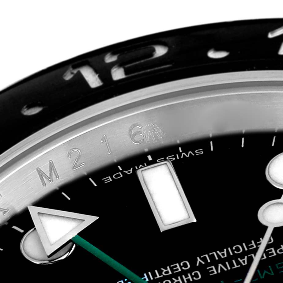 The image shows a close-up of the Rolex GMT-Master 116710 Men
s Stainless Steel Black Dial 116710 Men
s Stainless Steel Black Dial watch dial, highlighting the bezel, hour markers, and hands.