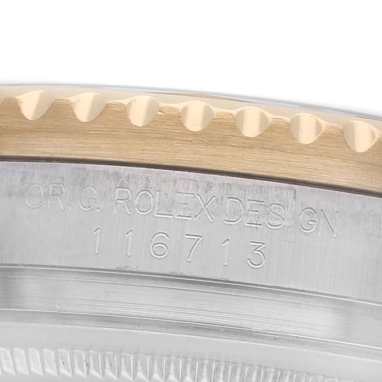 The image shows a close-up of the Rolex GMT-Master 116713 Men
s Steel and Gold (two tone) Black Dial
s bezel and engraved case design.