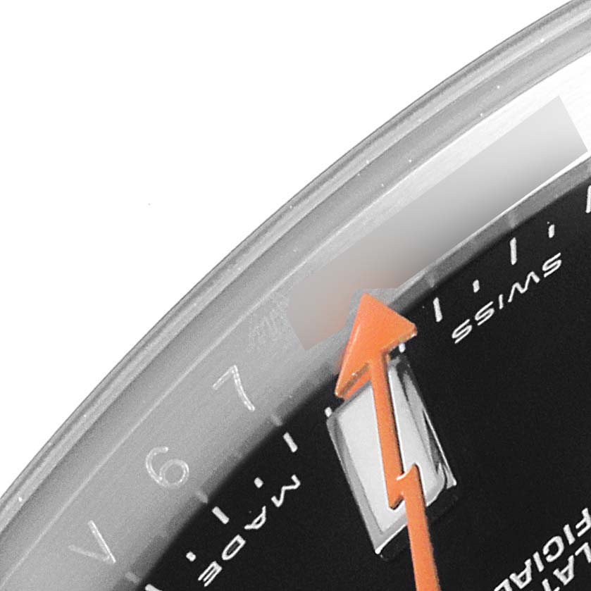 This image shows a close-up angle of the Rolex Milgauss 116400 Men's Stainless Steel Black Dial 116400 Men's Stainless Steel Black Dial watch, focusing on the orange lightning bolt second hand, part of the dial, and the "Swiss Made" text.