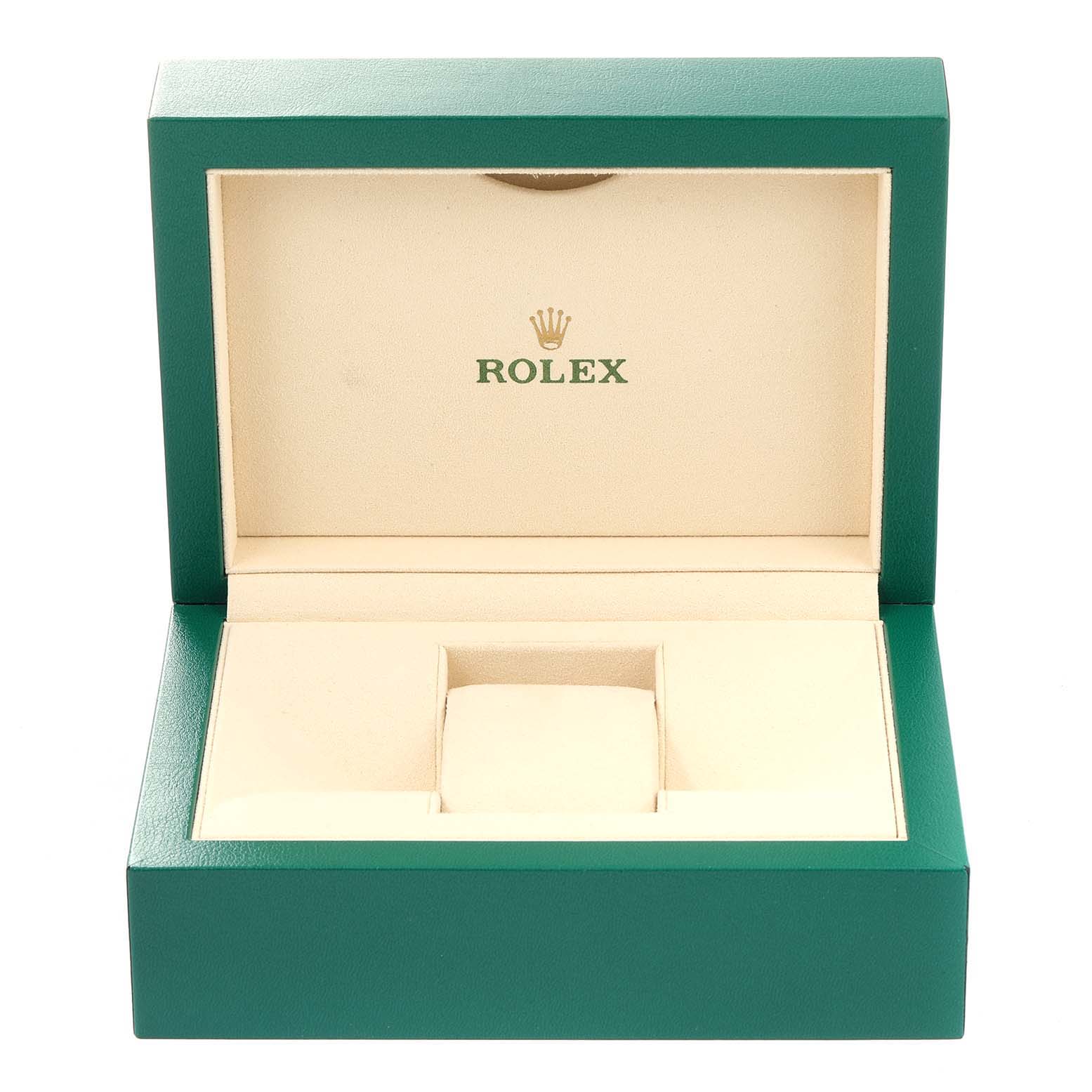 The image shows an open, empty Rolex watch box for an Oyster Perpetual model, with the Rolex logo inside the lid.