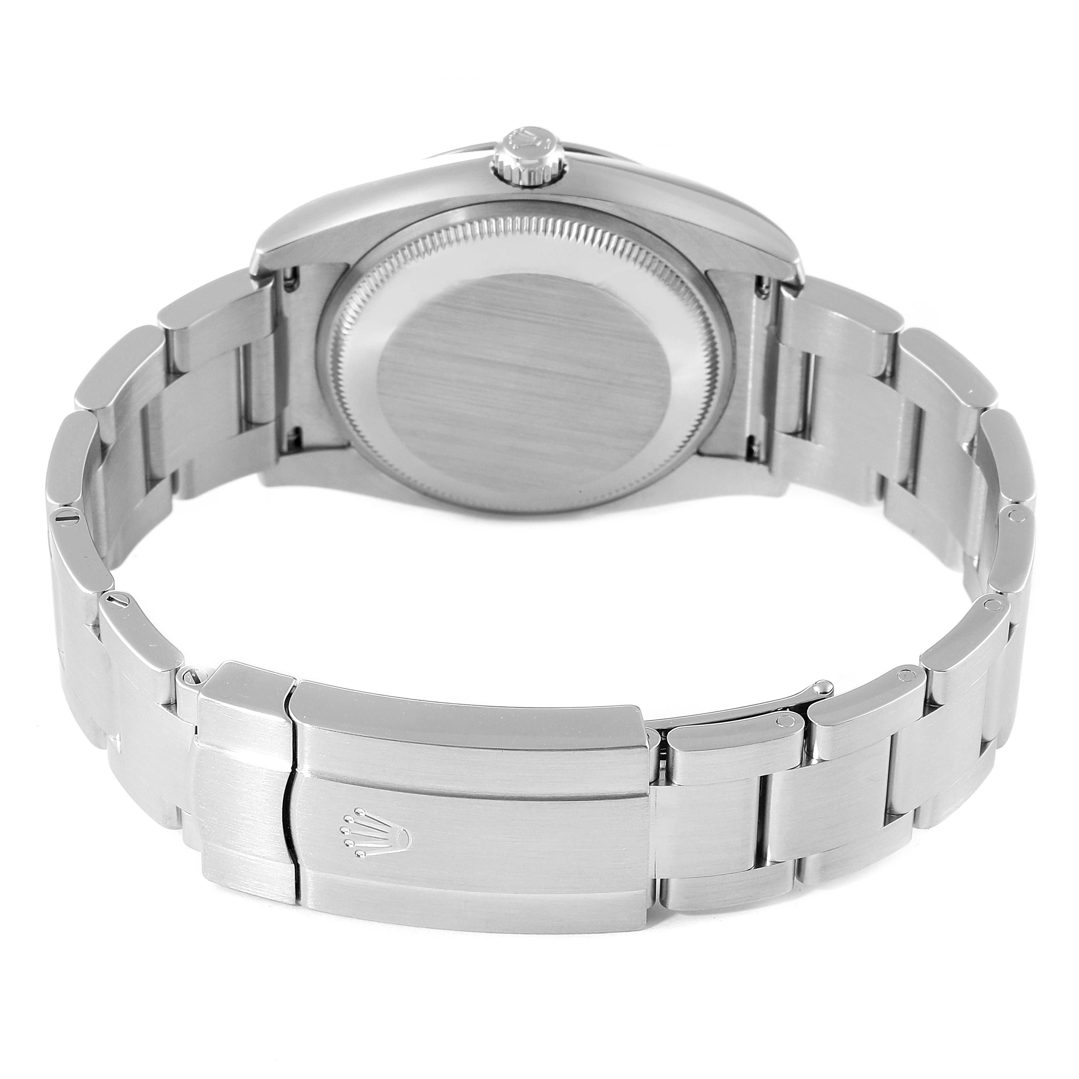 The image shows the back side and bracelet clasp of the Rolex Oyster Perpetual 114200 Men's Stainless Steel Champagne Dial 114200 Men's Stainless Steel Champagne Dial watch.