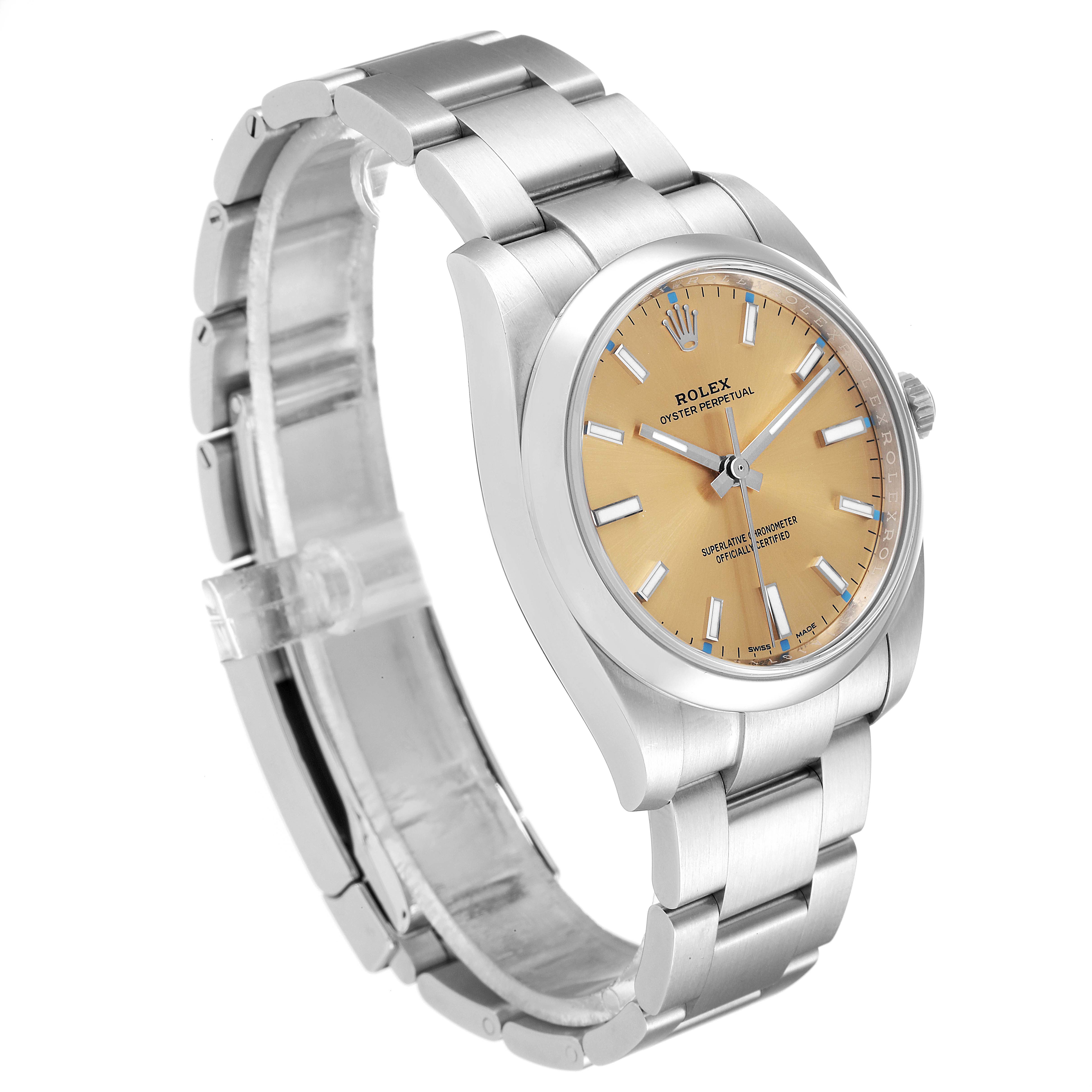The Rolex Oyster Perpetual 114200 Men's Stainless Steel Champagne Dial 114200 Men's Stainless Steel Champagne Dial watch is shown at an angle displaying the face, bezel, crown, and bracelet with a yellow dial.