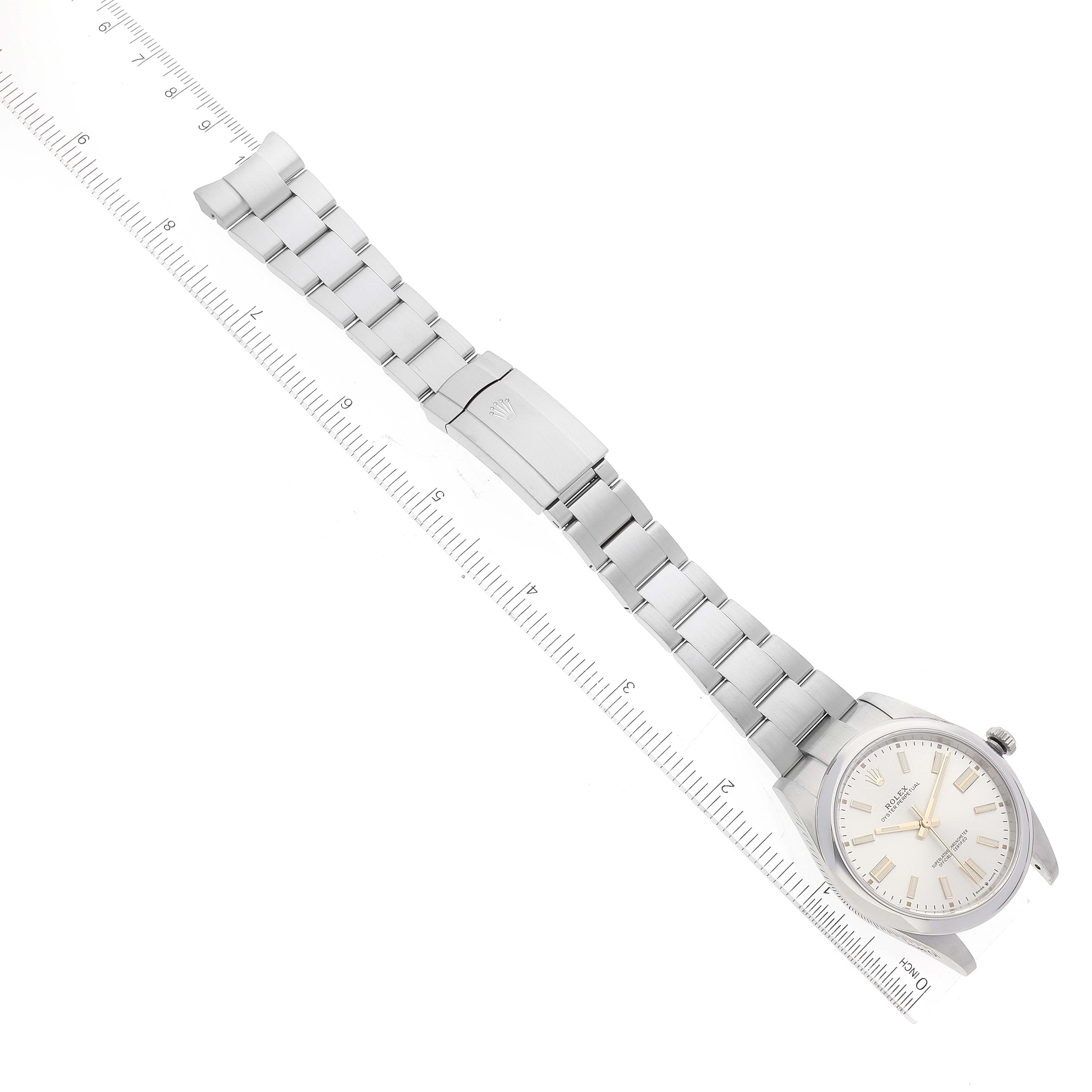 This image shows a top-down view of a Rolex Oyster Perpetual 124300 Men's Stainless Steel Silver Dial 124300 Men's Stainless Steel Silver Dial watch, including its face and full metal bracelet.