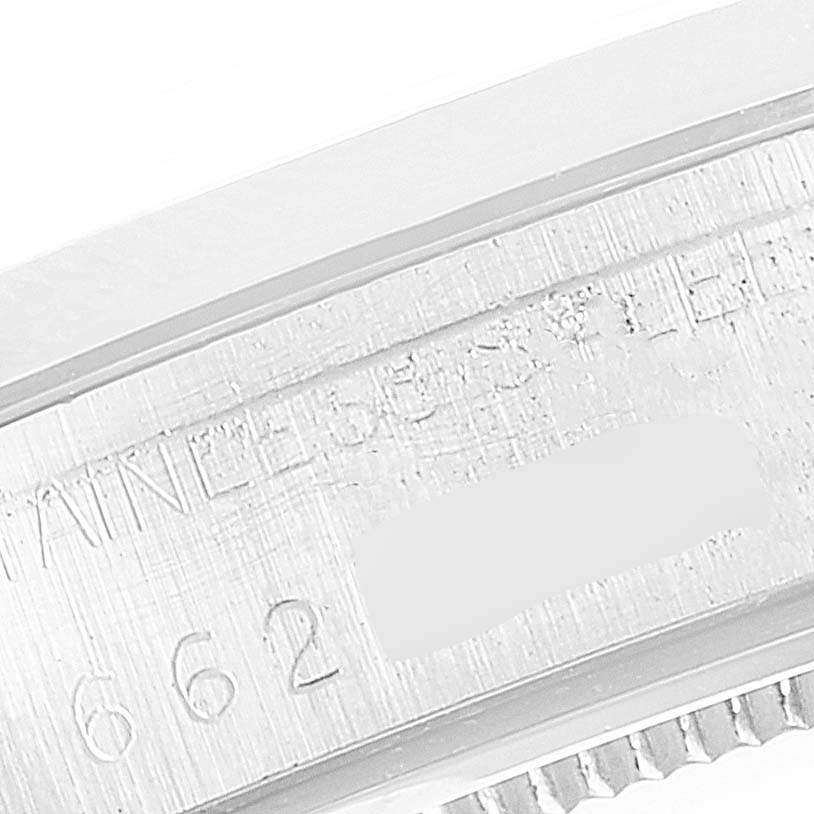 The image shows a close-up of the serial number engraving on a Rolex Vintage Collection 6694 Men's Stainless Steel Silver Dial 6694 Men's Stainless Steel Silver Dial model watch.