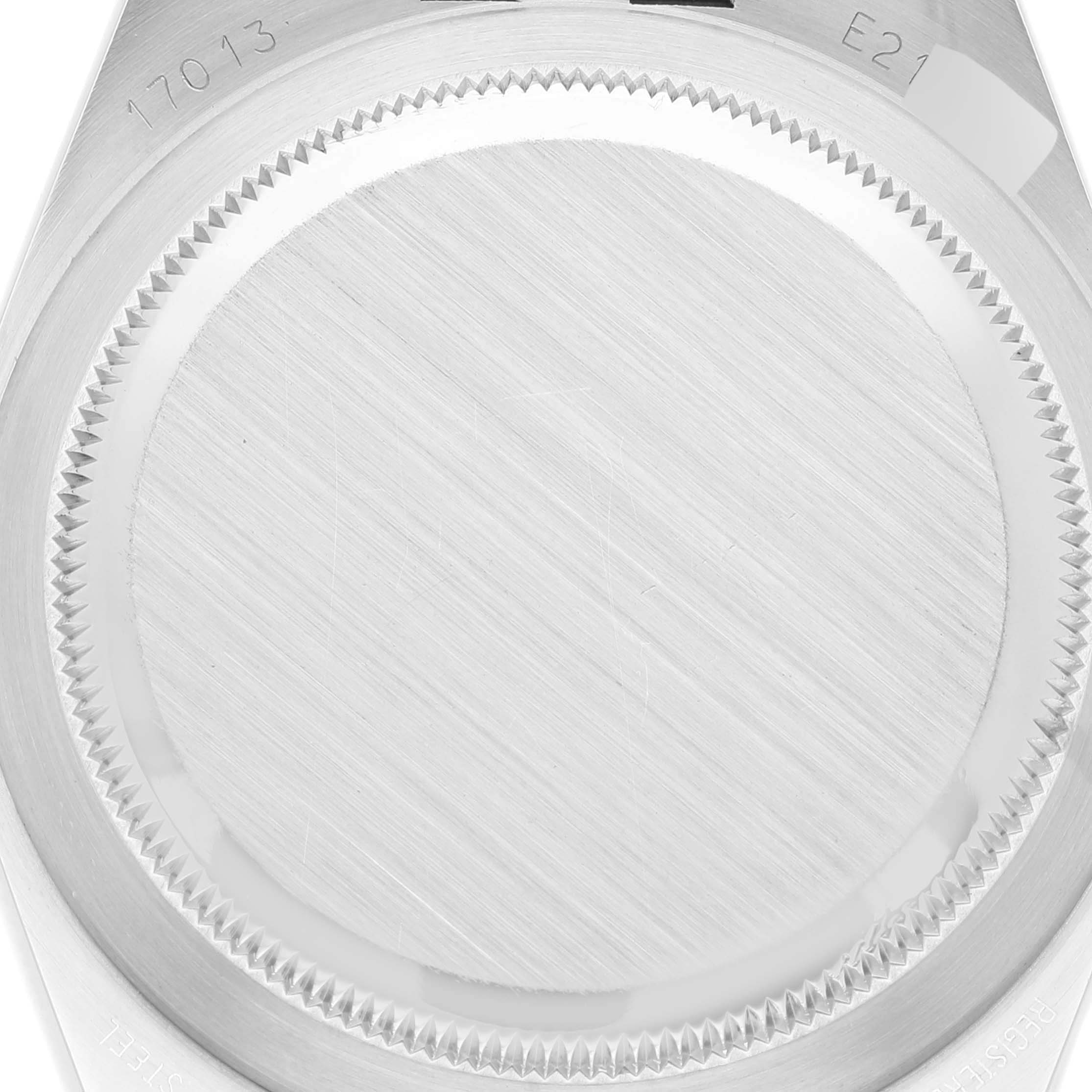 This image shows a close-up of the case back of a Rolex Oysterquartz 17013 Men
s Stainless Steel Silver Dial 17013 Men
s Stainless Steel Silver Dial model watch, highlighting the brushed metal finish and engraved model numbers.