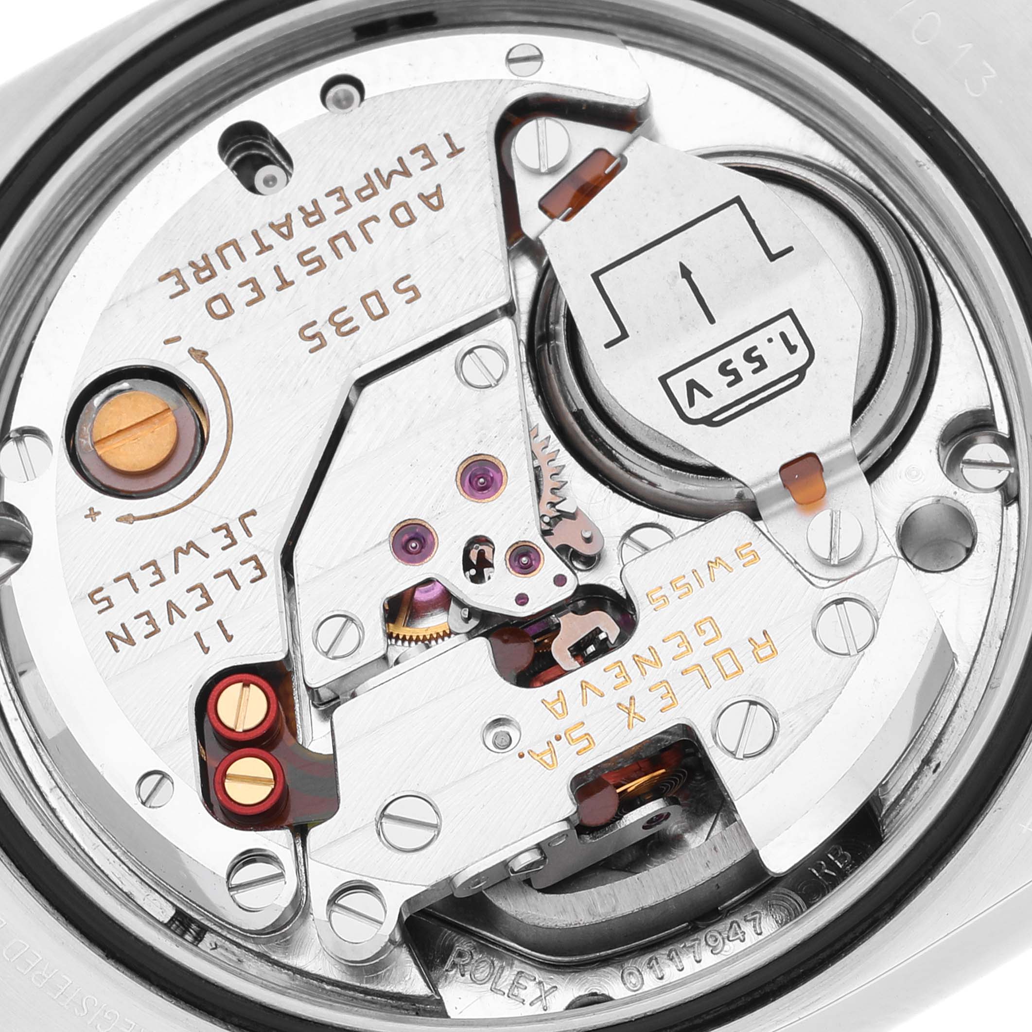 This close-up image shows the intricate inner workings of a Rolex Oysterquartz 17013 Men
s Stainless Steel Silver Dial 17013 Men
s Stainless Steel Silver Dial watch movement.