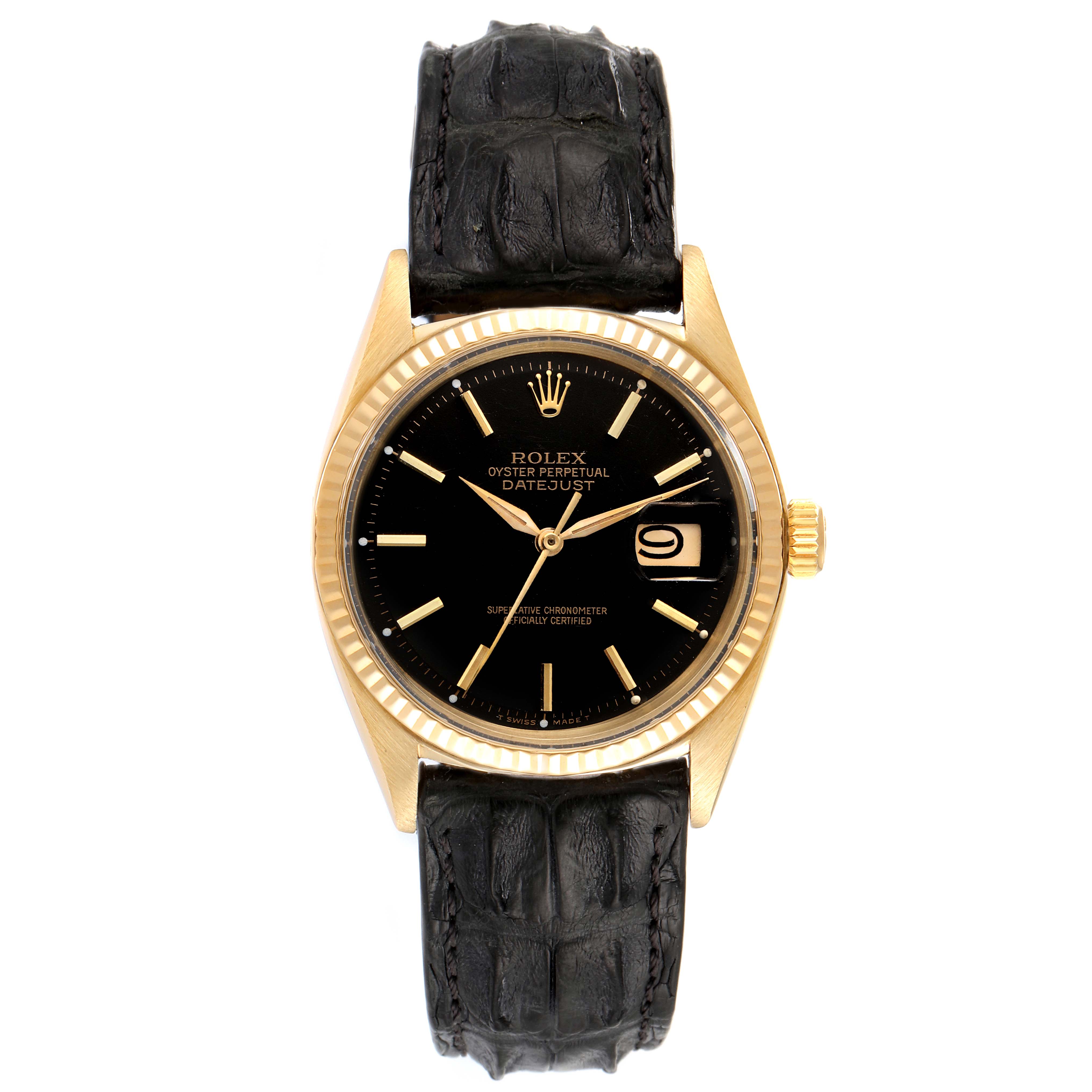 The image shows a front view of a Rolex Vintage Collection 1601 Men's Yellow Gold Black Dial 1601 Men's Yellow Gold Black Dial Oyster Perpetual Datejust watch with a black dial and a black leather strap.