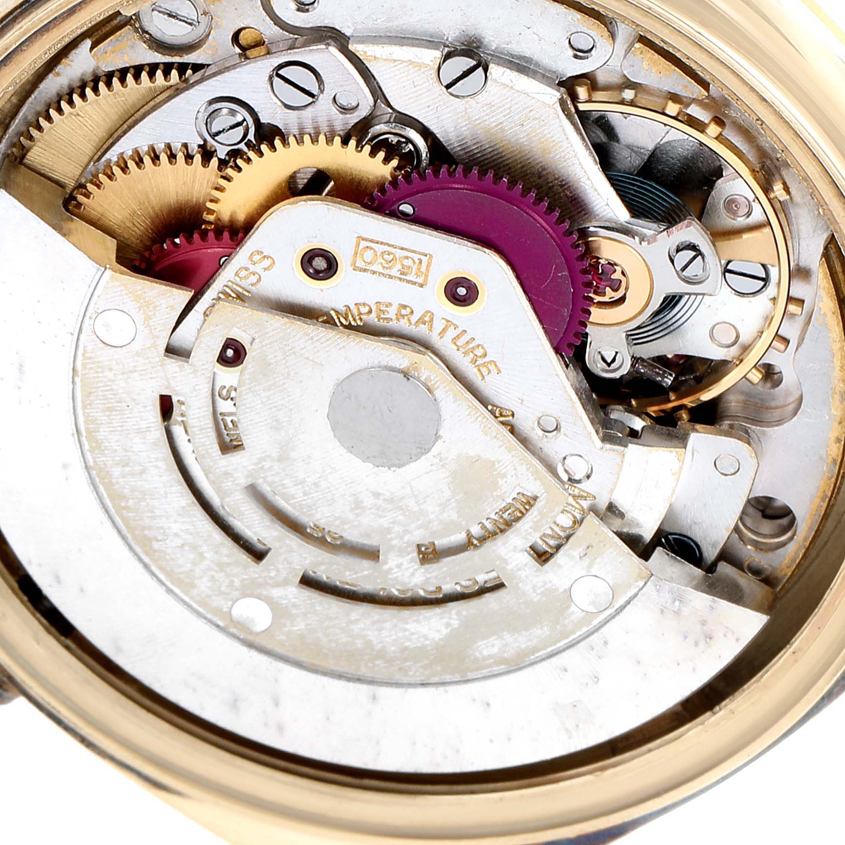 The image shows a close-up of the internal mechanism of a Rolex Vintage Collection 1601 Men's Yellow Gold Black Dial 1601 Men's Yellow Gold Black Dial watch.