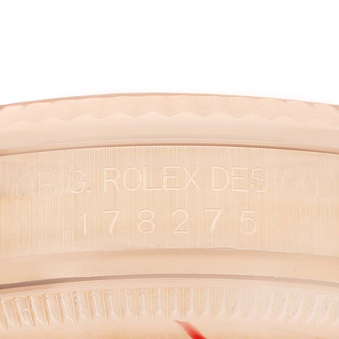 The image shows the side of a Rolex President 178275 Women's Rose Gold Pink Dial watch, highlighting the engravings on the case.
