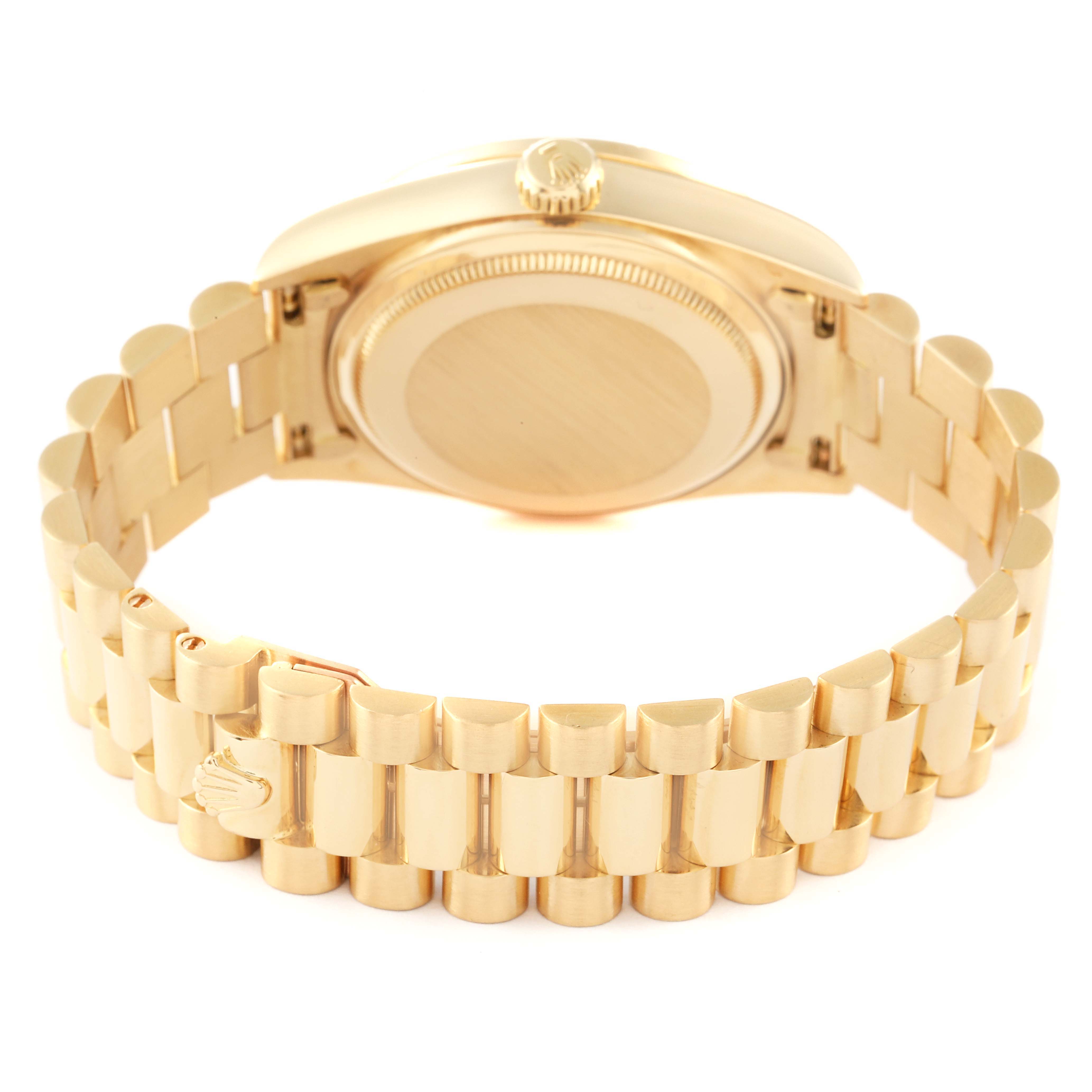 The image shows the back and bracelet of a gold Rolex President 18138 Men
s Yellow Gold Champagne Dial 18138 Men
s Yellow Gold Champagne Dial model watch.