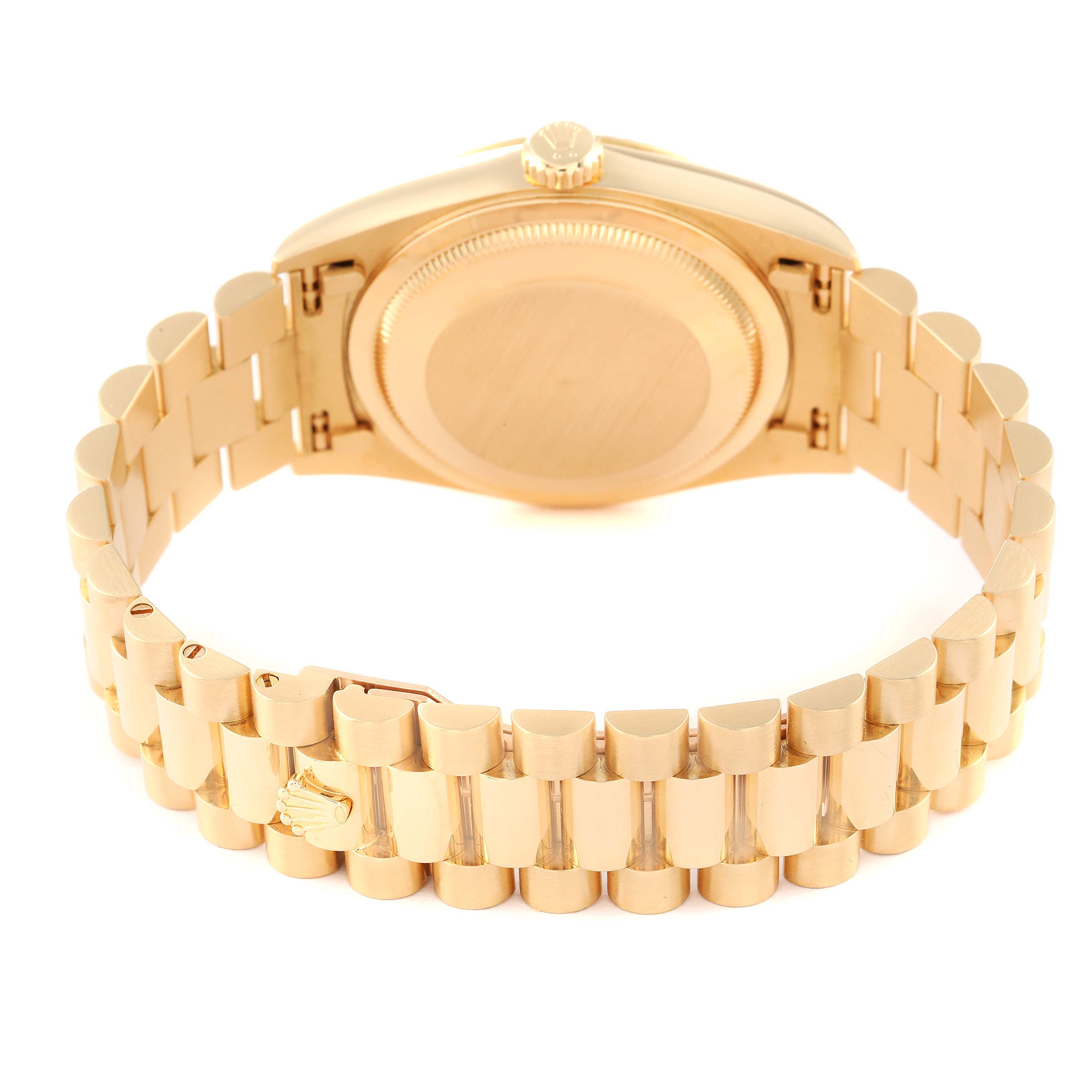 The image shows the backside of a Rolex President 18238 Men
s Yellow Gold Champagne Dial 18238 Men
s Yellow Gold Champagne Dial model watch, highlighting its gold bracelet and caseback.