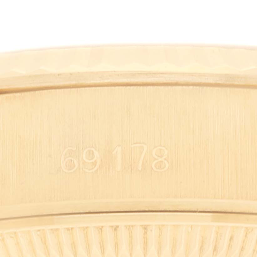 The image shows a close-up of the case side of a Rolex President 69178 Women
s Yellow Gold Champagne Dial 69178 Women
s Yellow Gold Champagne Dial model 69178, displaying its model number.