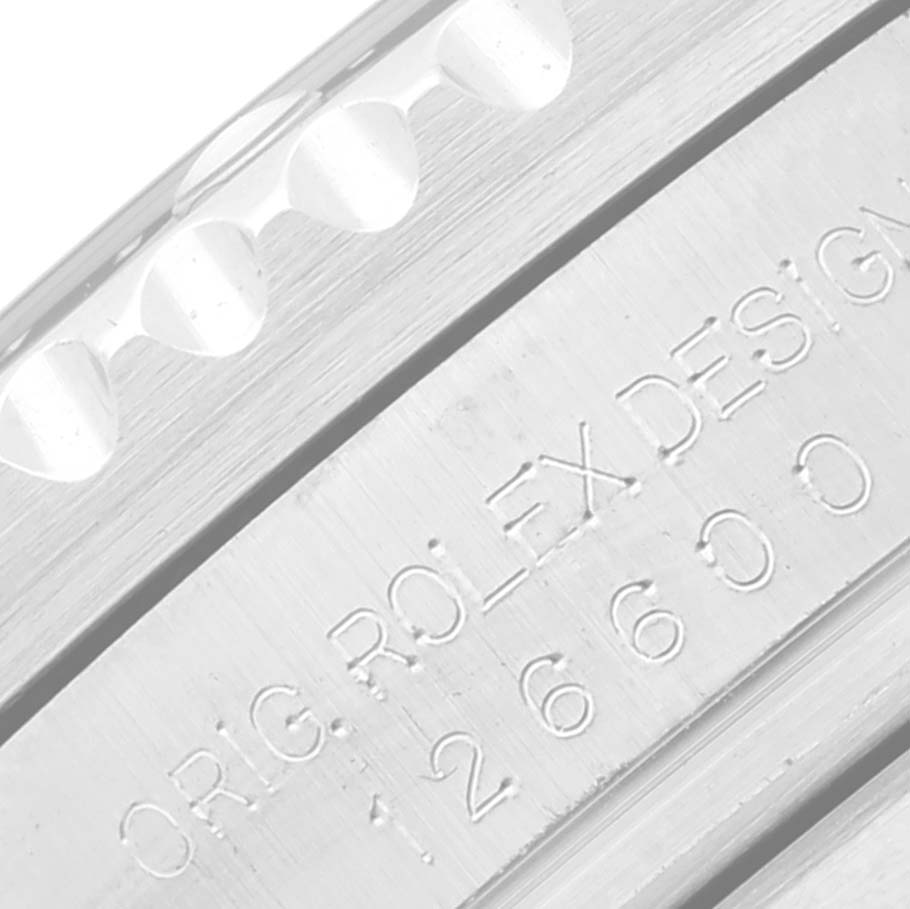 This is a close-up image of the side engraving of a Rolex Sea-Dweller 126600 Men's Stainless Steel Black Dial 126600 Men's Stainless Steel Black Dial model 126600 watch.