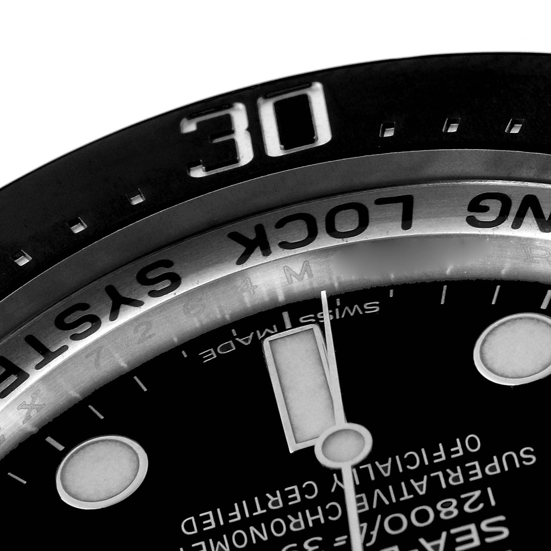 This image shows a close-up of the bezel, dial, and part of the hands of the Rolex Sea-Dweller 116660 Men's Stainless Steel Blue Dial 116660 Men's Stainless Steel Blue Dial watch.