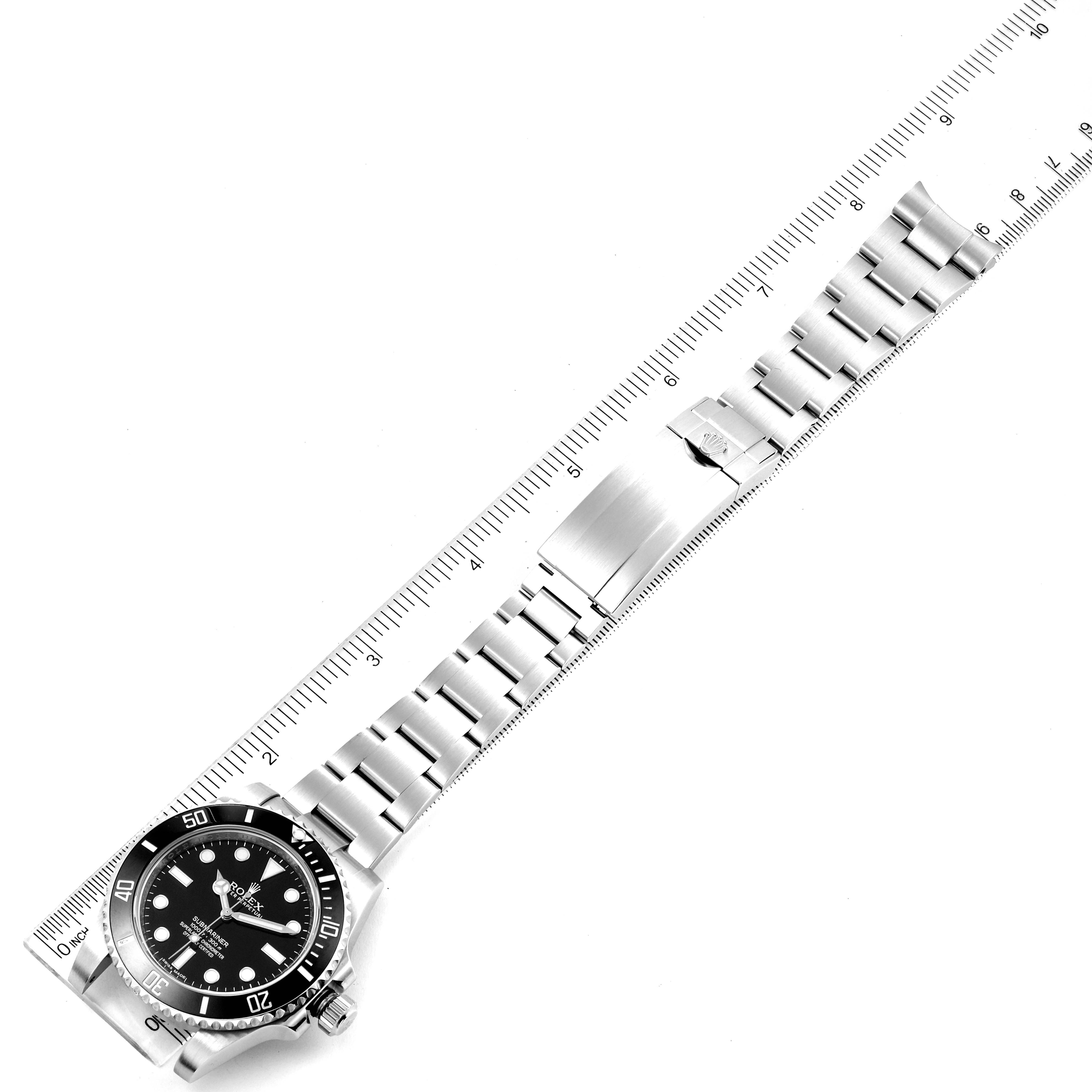 The image shows a top-down view of a Rolex Submariner 114060 Men
s Stainless Steel Black Dial 114060 Men
s Stainless Steel Black Dial watch, highlighting its stainless steel bracelet and bezel.