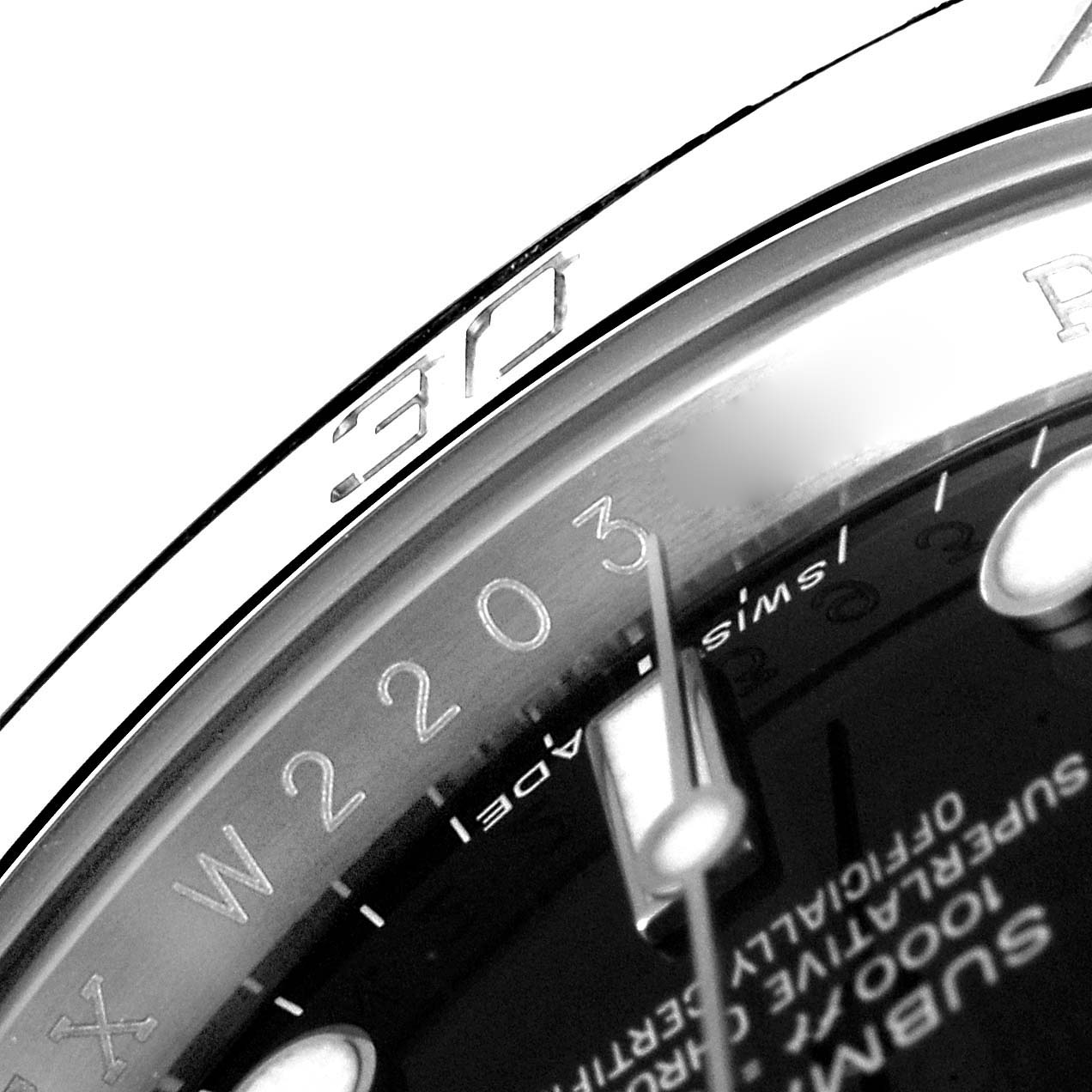 The image shows a close-up of the dial and bezel of the Rolex Submariner 114060 Men
s Stainless Steel Black Dial 114060 Men
s Stainless Steel Black Dial watch, focusing on the 30-second marker and part of the text.