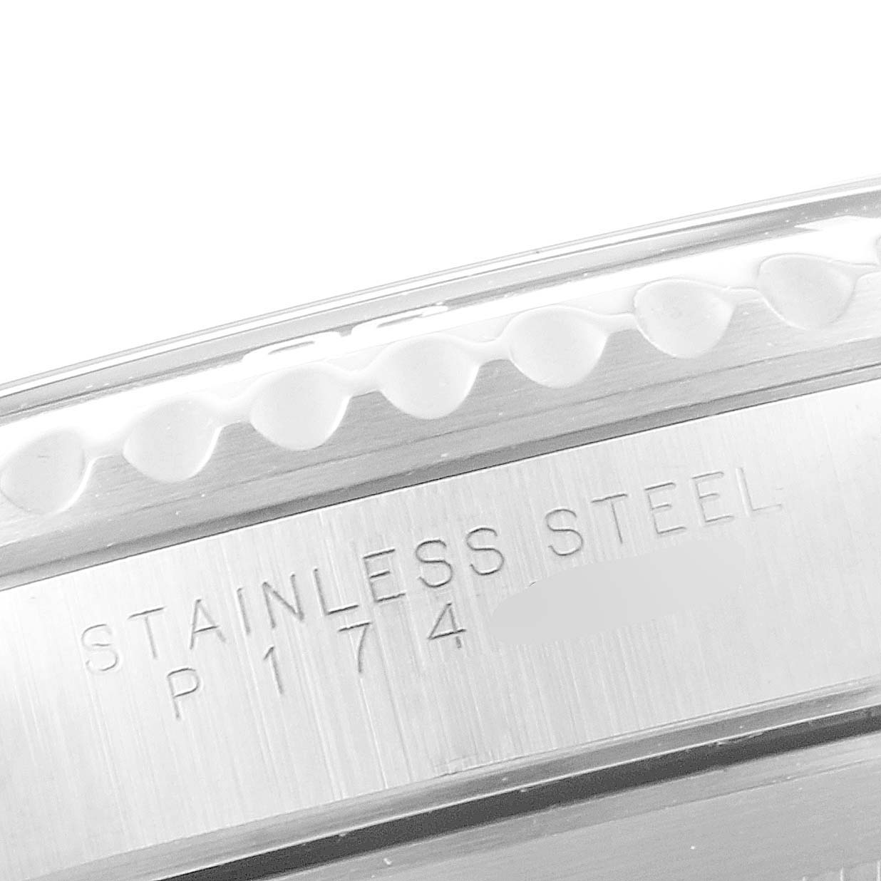 The image shows a close-up of the case back and bezel edge of a Rolex Submariner 14060 Men
s Stainless Steel Black Dial 14060 Men
s Stainless Steel Black Dial, highlighting the "Stainless Steel" engraving.