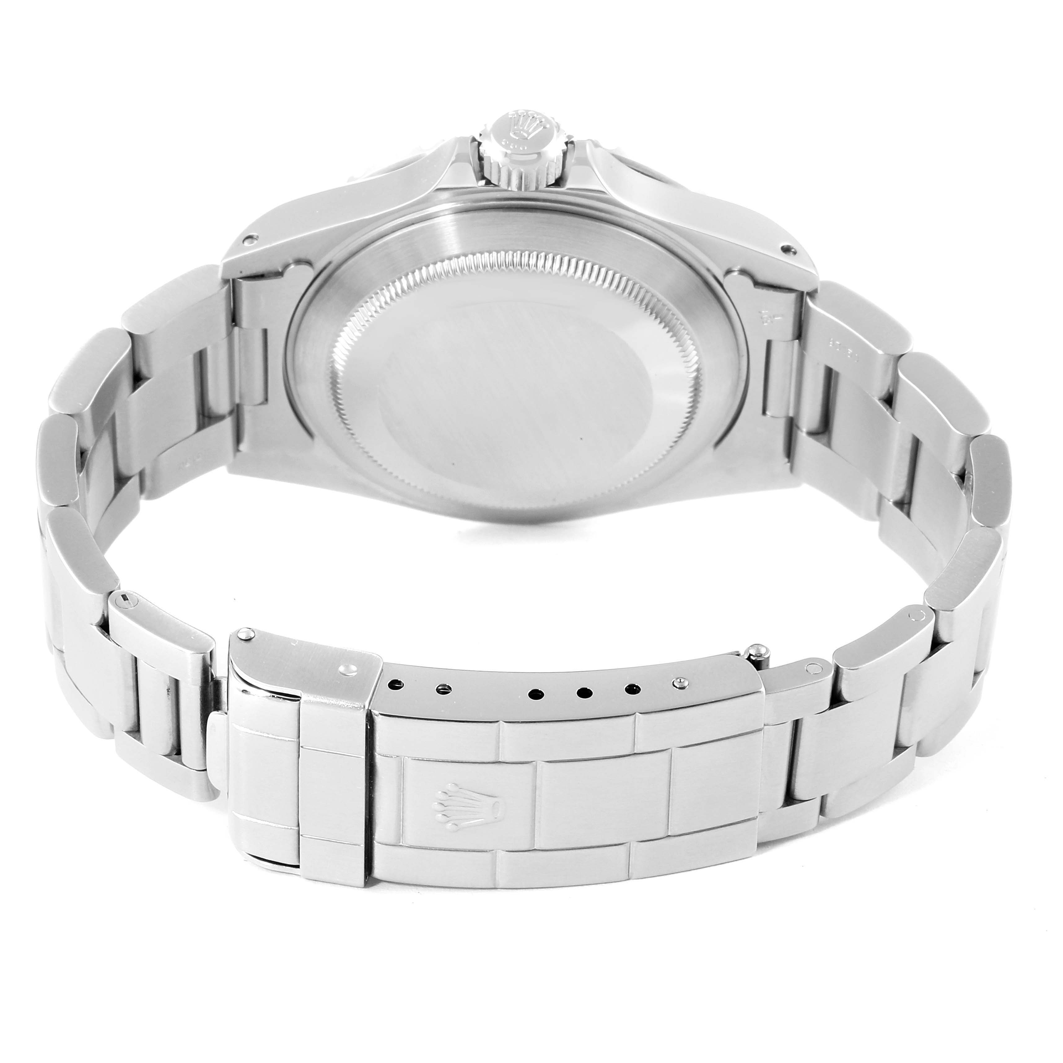 The image shows the back view of a Rolex Submariner 14060 Men
s Stainless Steel Black Dial 14060 Men
s Stainless Steel Black Dial watch, focusing on the case back and the bracelet
s clasp.