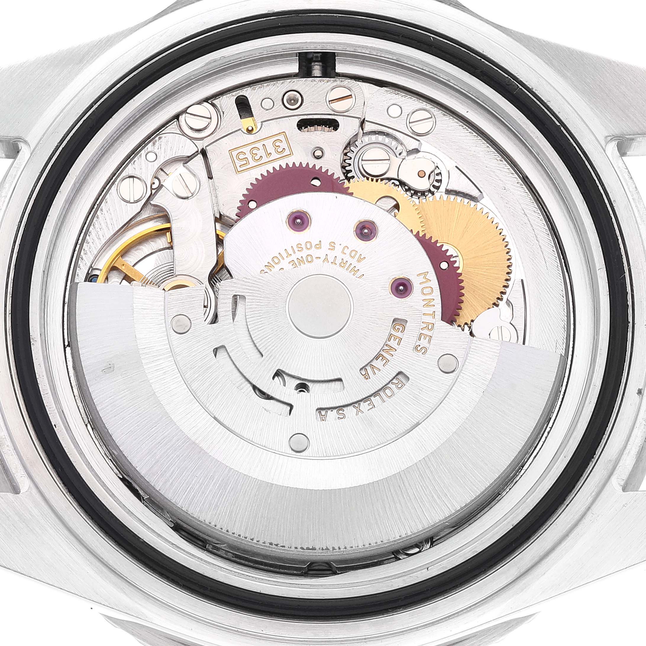 The image shows the internal mechanism of a Rolex Submariner 16610 Men
s Stainless Steel Black Dial 16610 Men
s Stainless Steel Black Dial watch, viewed from the back, displaying gears and movement components.