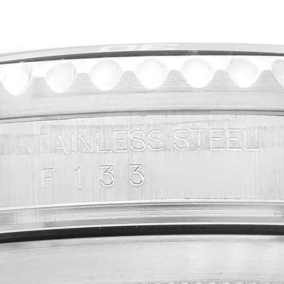 This image shows a close-up of the side of the stainless steel casing for a Rolex Submariner 16610 Men
s Stainless Steel Black Dial 16610 Men
s Stainless Steel Black Dial watch.