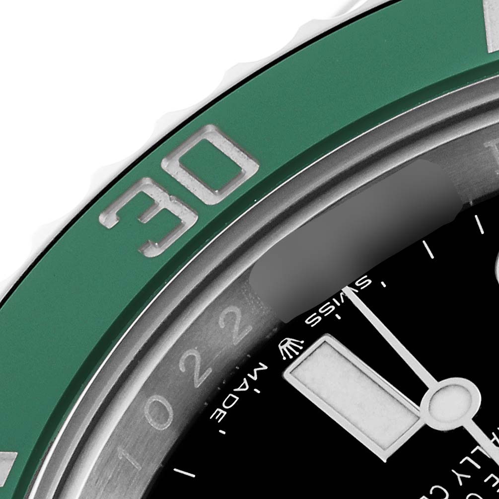 This image shows a close-up of the bezel and part of the dial of a Rolex Submariner 126610LV Men
s Stainless Steel Black Dial 126610LV Men
s Stainless Steel Black Dial watch.