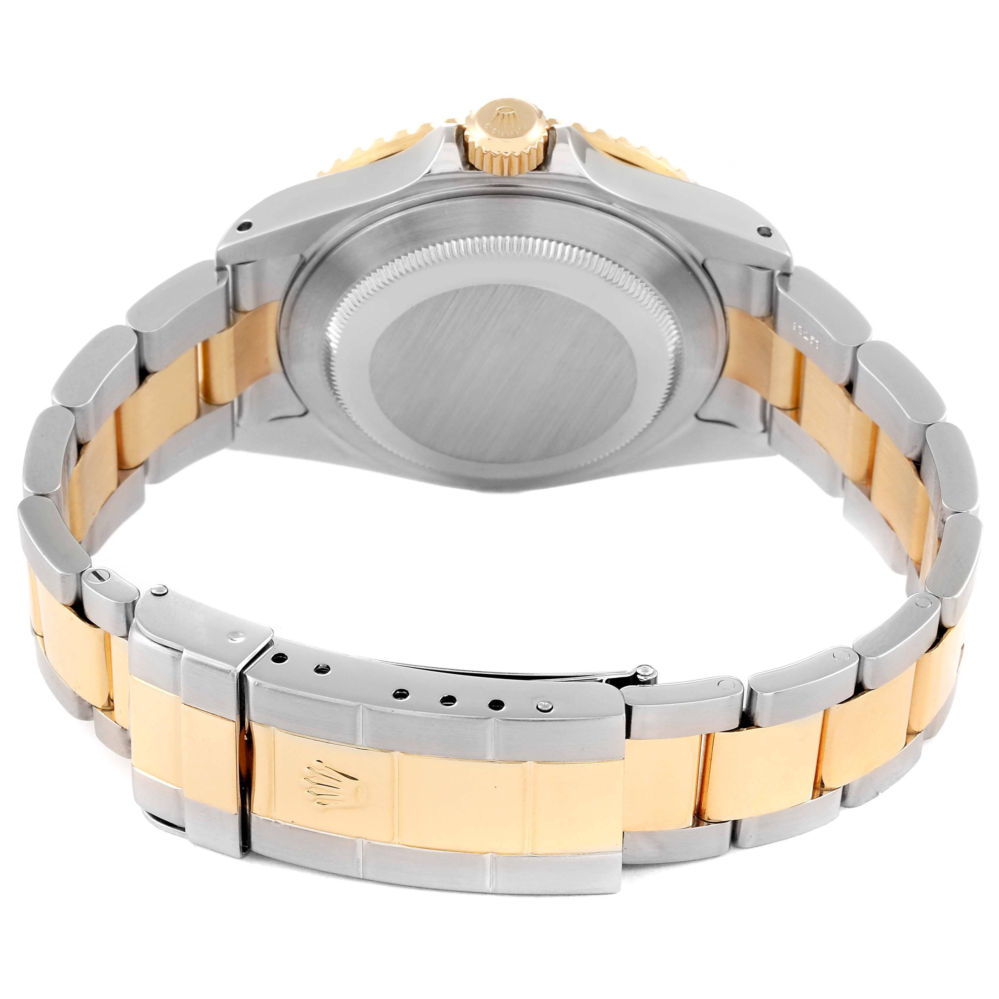 The image shows the back view of a Rolex Submariner 16613 Men's Steel and Gold (two tone) Black Dial 16613 Men's Steel and Gold (two tone) Black Dial watch, highlighting its case back, bracelet, and clasp.