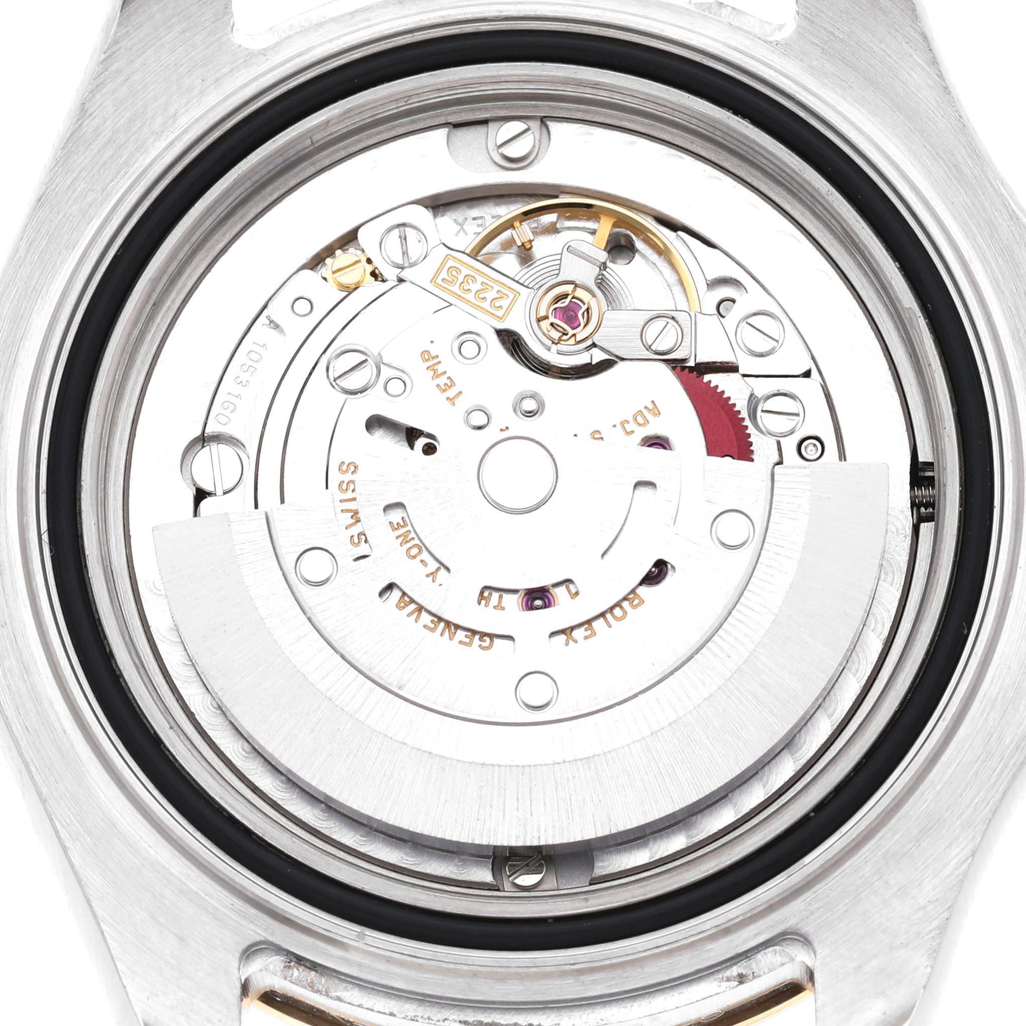 The image shows the internal movement mechanism of a Rolex Yacht-Master 168623 Men's Steel and Gold (two tone) Champagne Dial watch from a back angle, highlighting gears and the rotor.