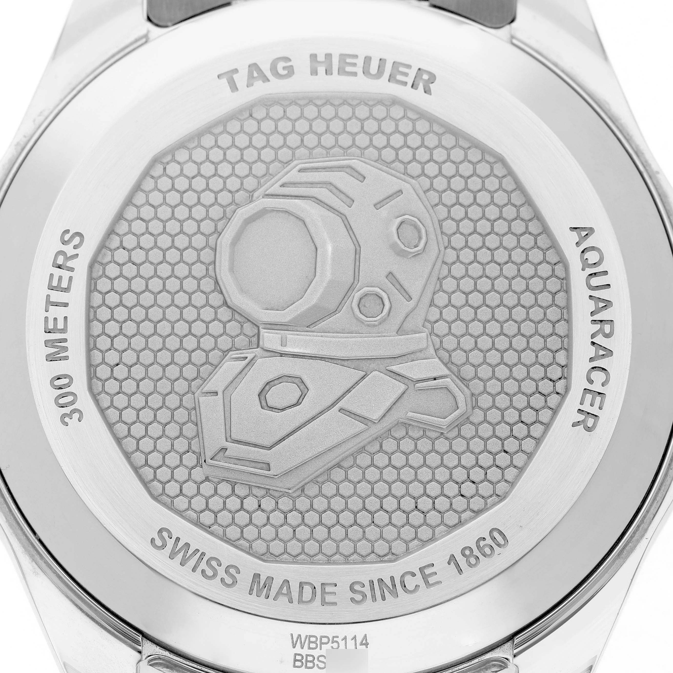 The image shows the backside of a Tag Heuer Aquaracer WBP5114 Men's Stainless Steel Blue Dial watch, featuring its engraved case back details.