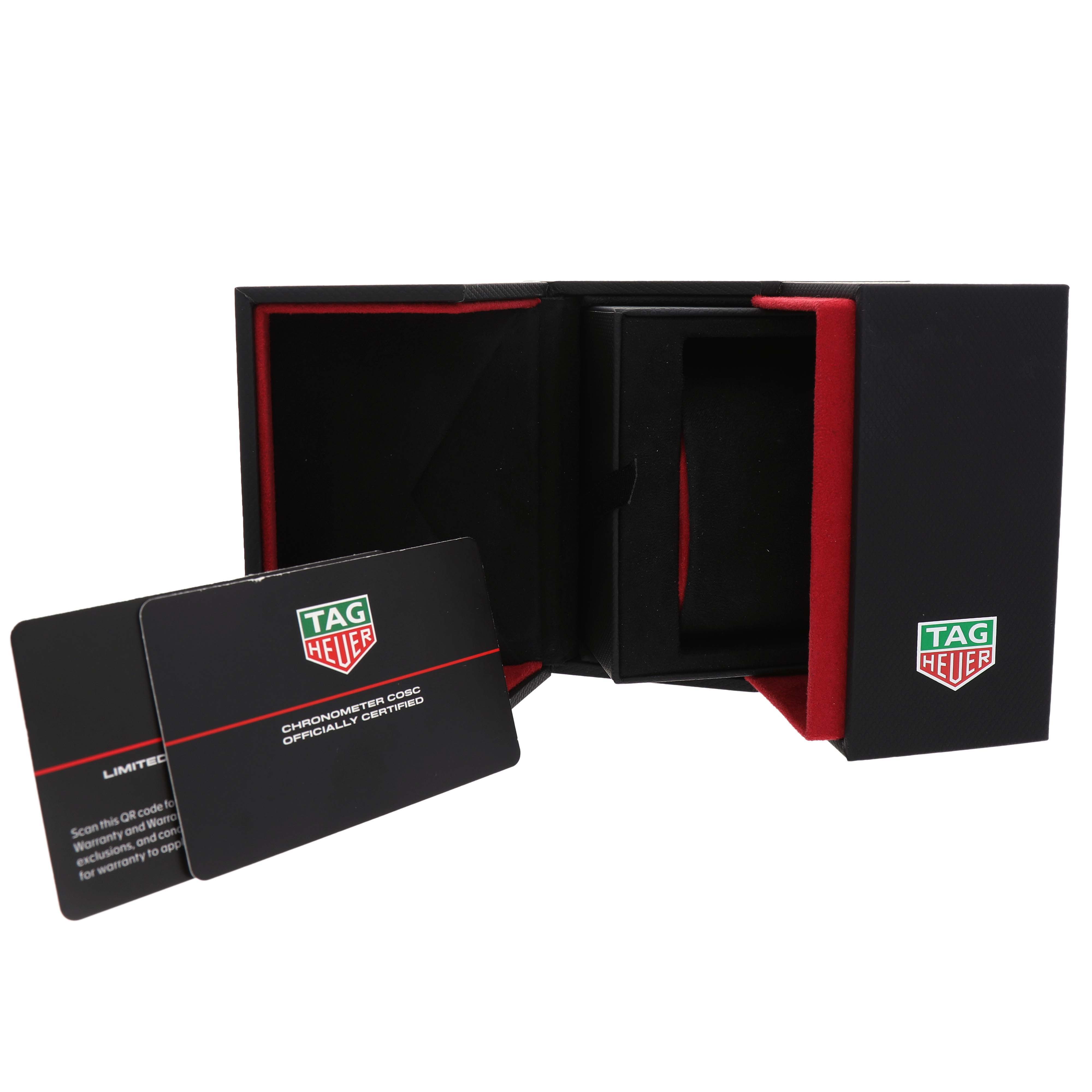 The image shows the TAG Heuer Aquaracer packaging and warranty cards, with the box open and cards leaning against it.
