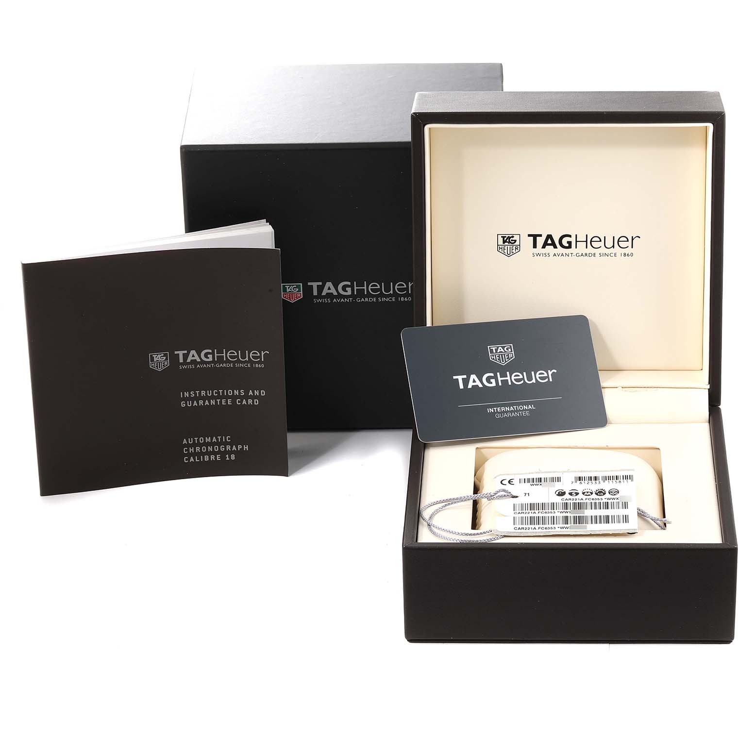 The image shows the packaging and accessories for a Tag Heuer Carrera CAR221A Men's Stainless Steel Silver Dial CAR221A Men's Stainless Steel Silver Dial watch, including the box, instruction manual, and guarantee card.