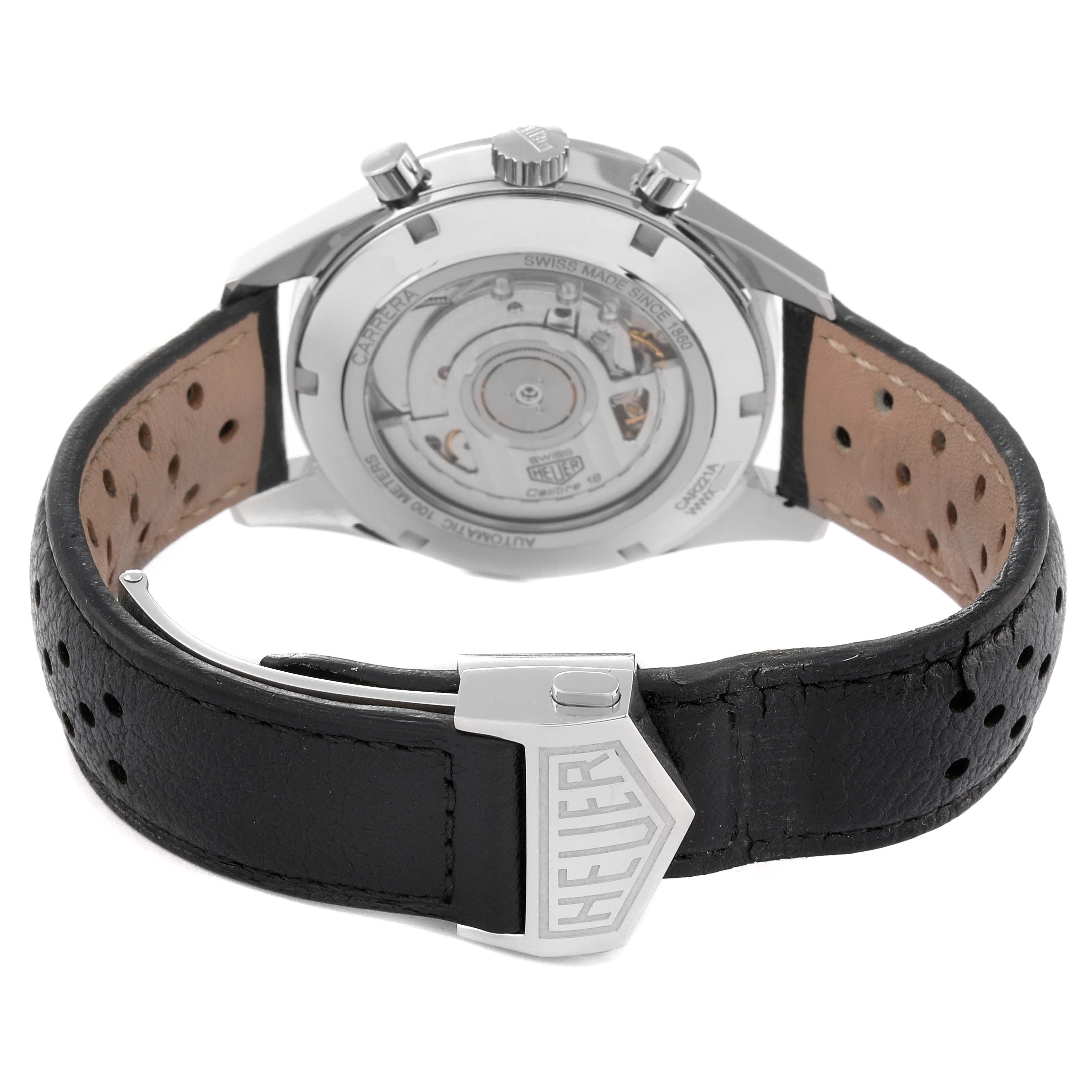 The image shows the back view of a Tag Heuer Carrera CAR221A Men's Stainless Steel Silver Dial CAR221A Men's Stainless Steel Silver Dial watch and its leather strap with a Tag Heuer clasp.