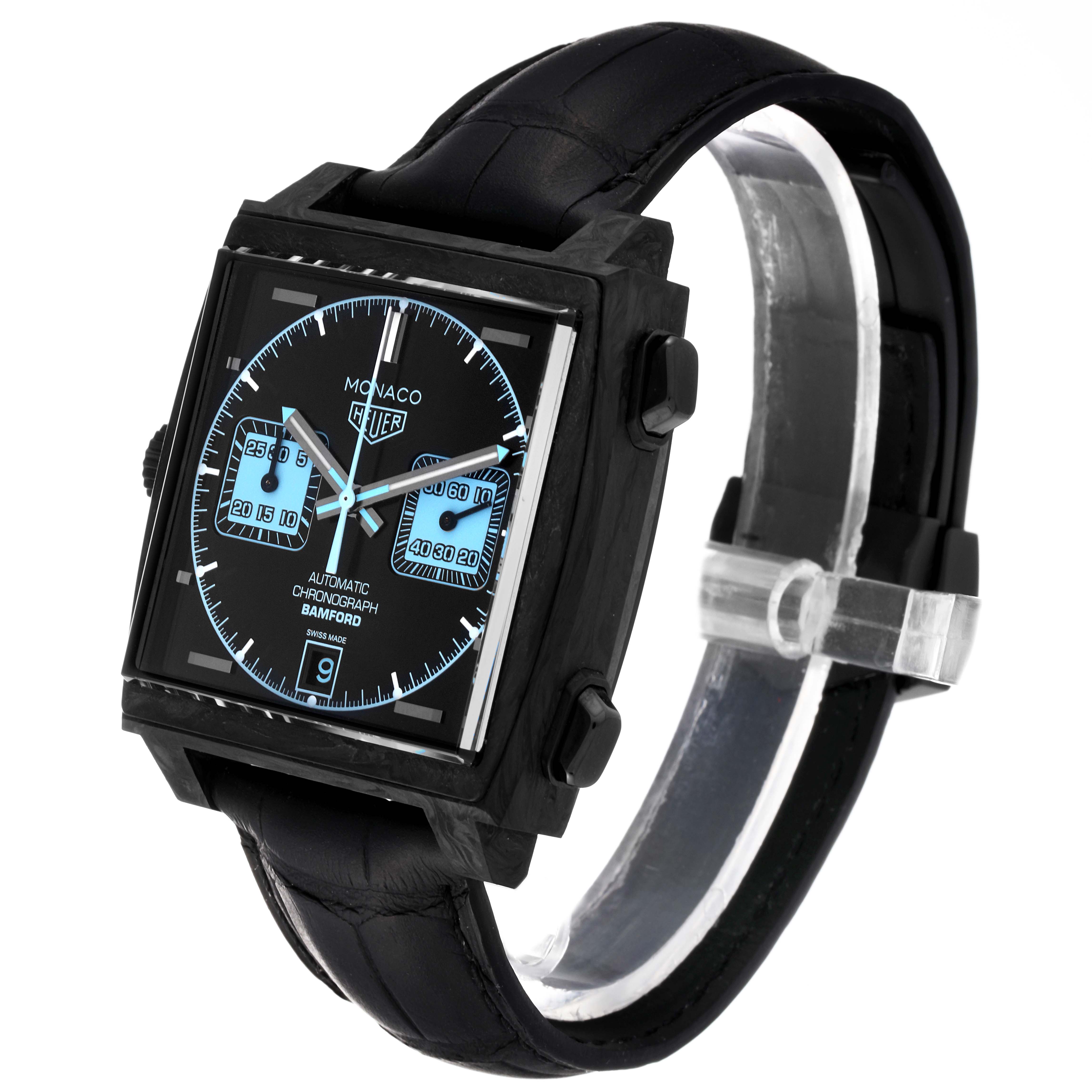 The image shows a Tag Heuer Monaco model watch at a three-quarter angle, highlighting its face, strap, and side buttons.