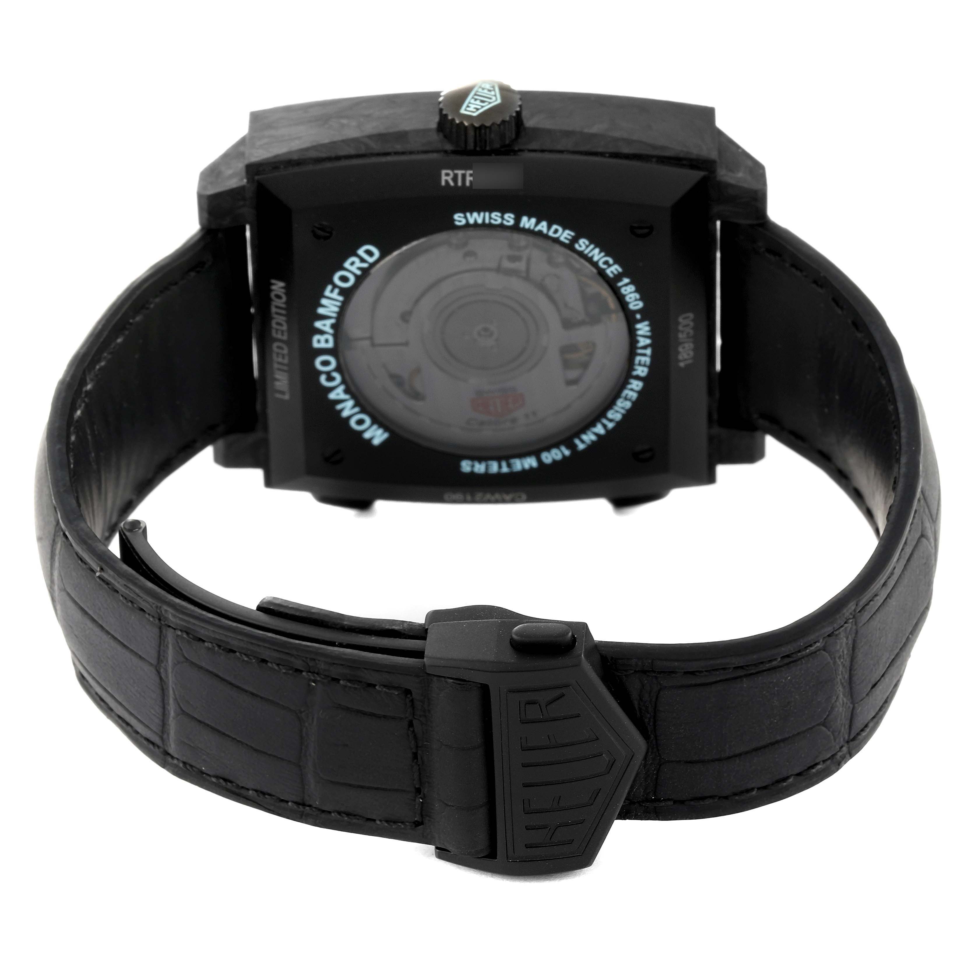 The image shows the back view of the Tag Heuer Monaco watch, highlighting the case back and strap.