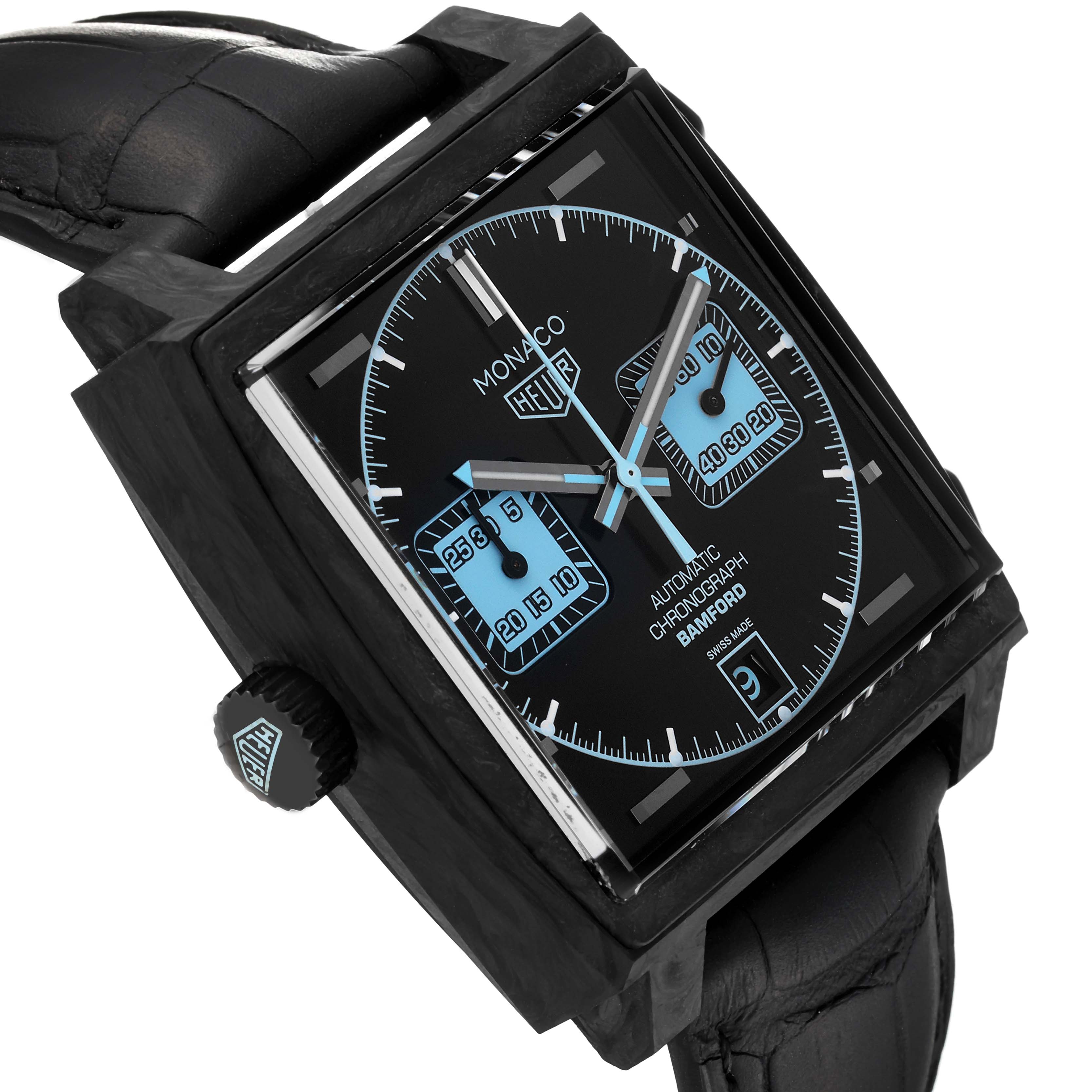 The Tag Heuer Monaco watch is shown at an oblique angle, highlighting the face, crown, and part of the strap.