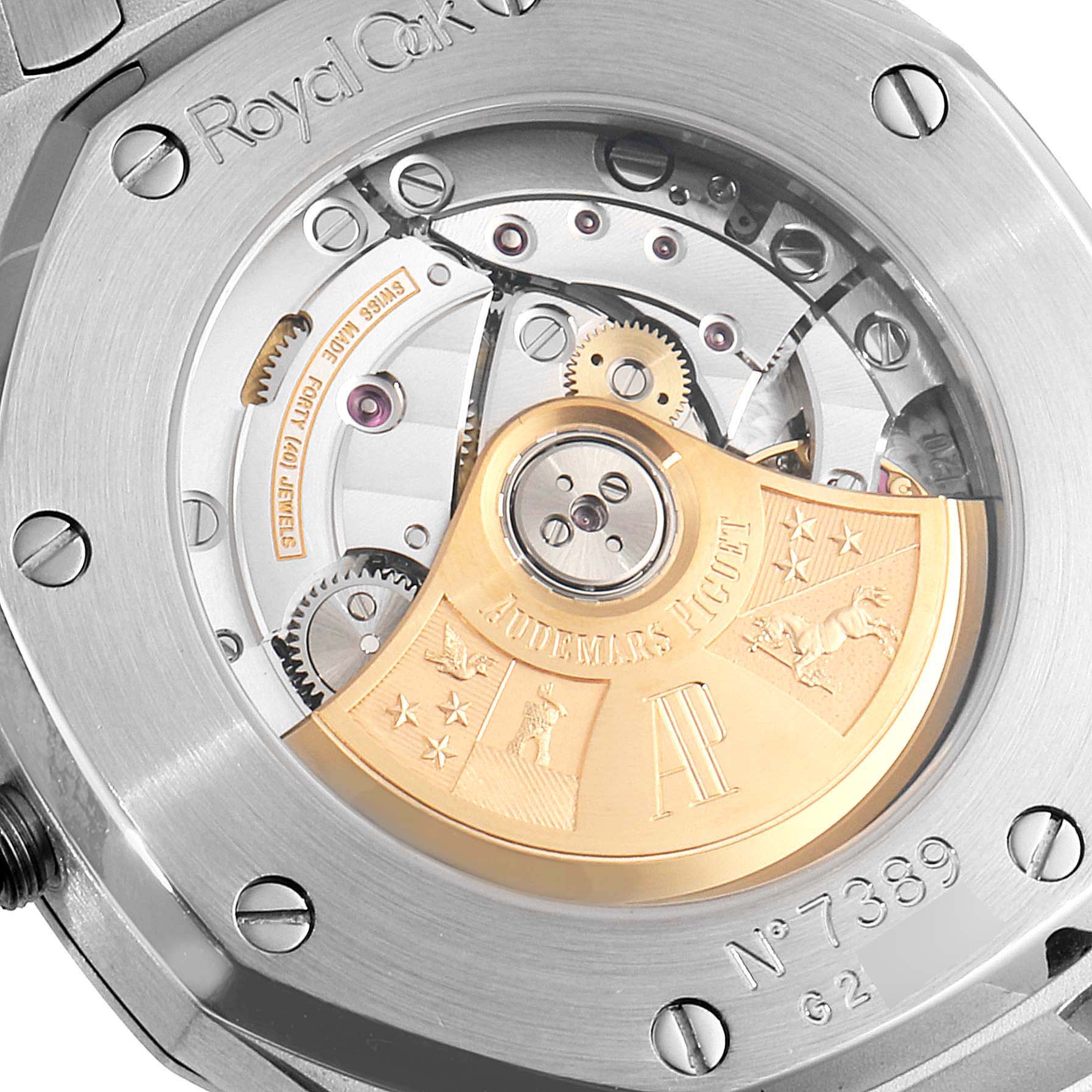 The image shows the back of the Audemars Piguet Royal Oak 15300ST Men
s Stainless Steel White Dial 15300ST Men
s Stainless Steel White Dial watch, highlighting its internal movement with gold rotor.
