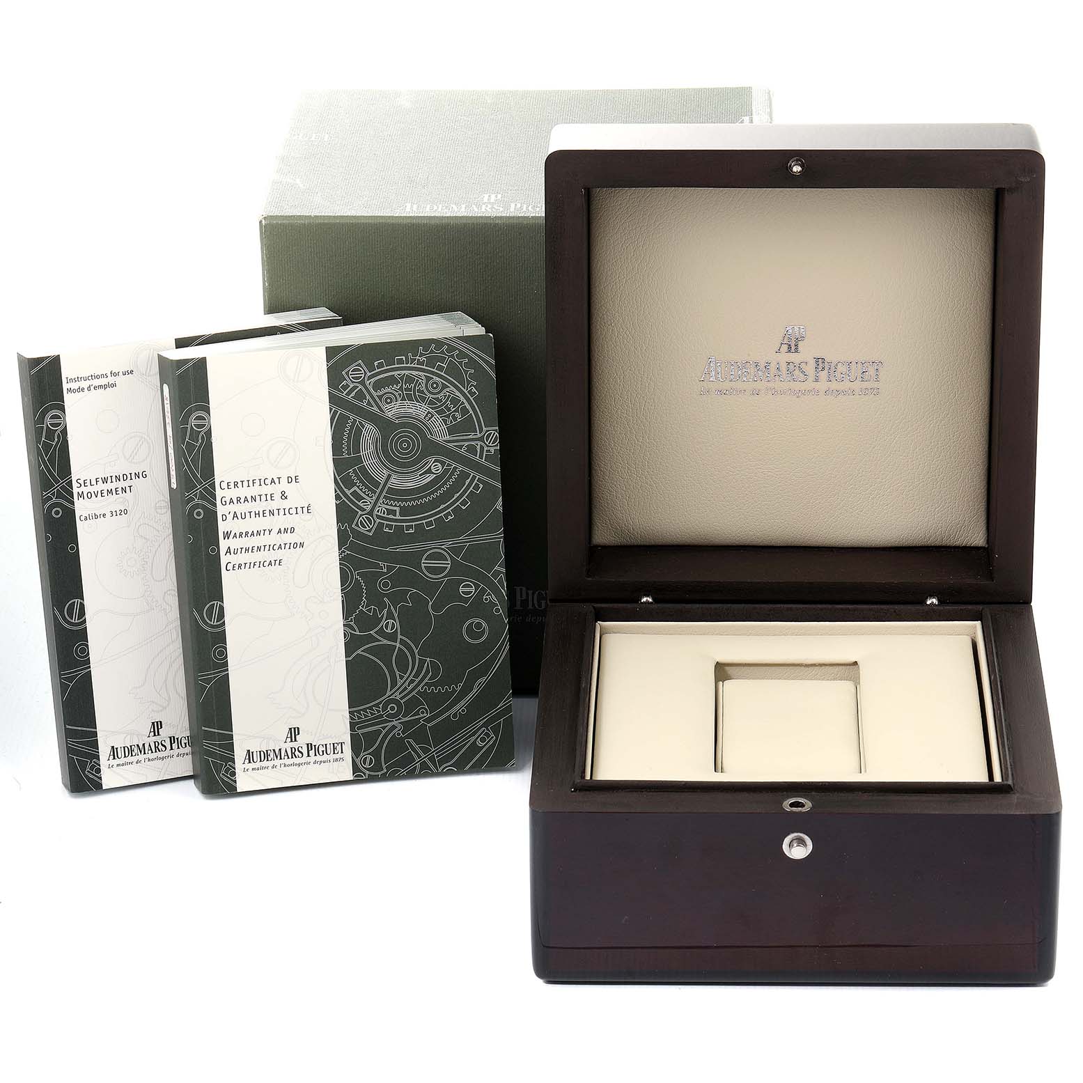 The image shows the packaging and accessories for a Royal Oak model by Audemars Piguet, including the watch box and booklets.