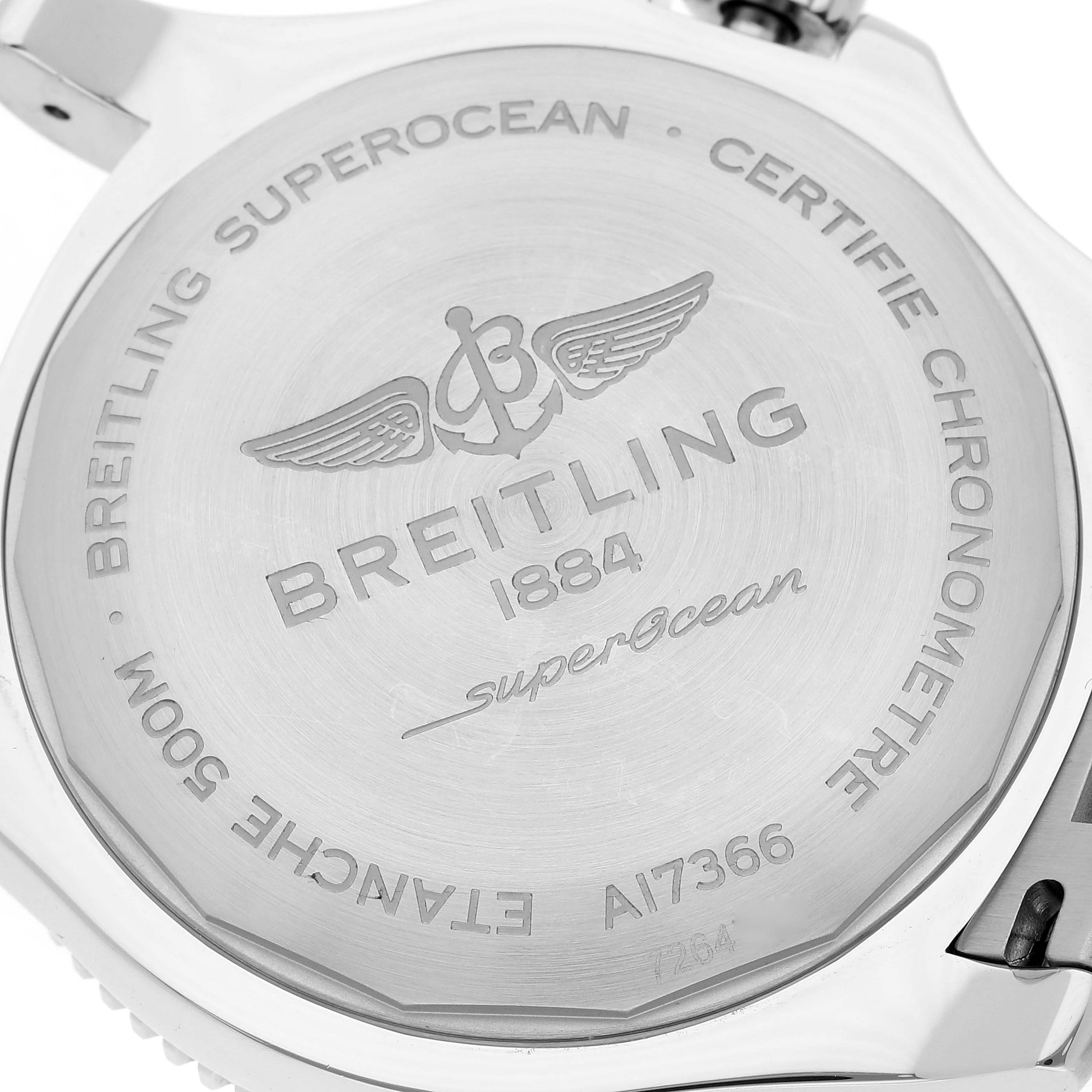 The image shows the back case of a Breitling Superocean A17366 Men's Stainless Steel Orange Dial A17366 Men's Stainless Steel Orange Dial watch with engraved details and branding.
