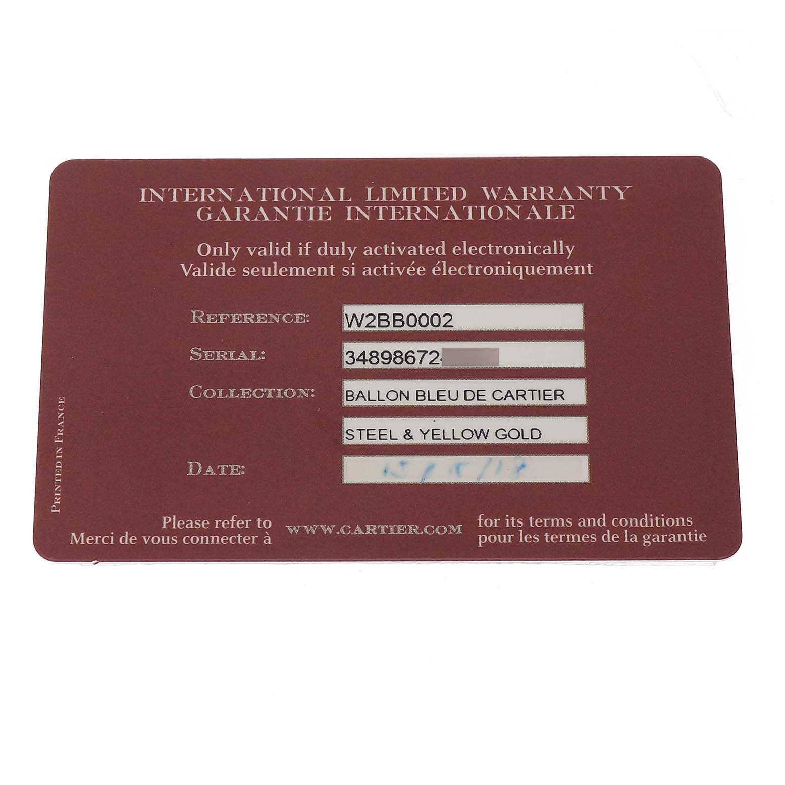 This image shows an International Limited Warranty card for a Cartier Ballon Bleu W2BB0002 Women's Stainless Steel Silver Dial watch, laying flat.