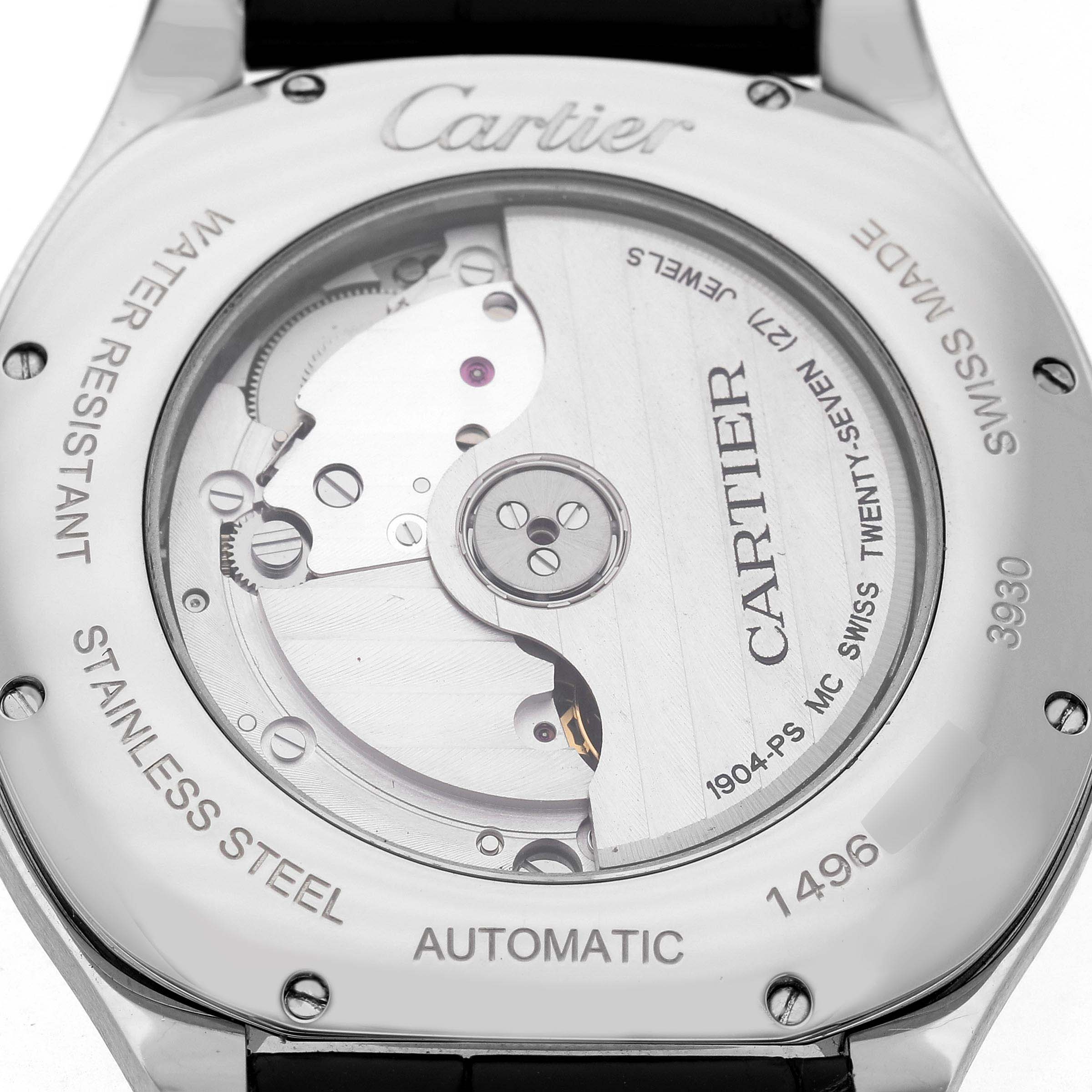 The image shows the back of a Drive de Cartier watch, highlighting its automatic movement and stainless steel case.