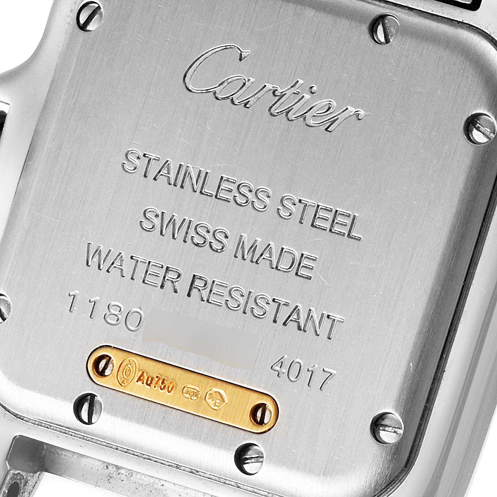 This image shows the back case of a stainless steel Panthere model watch by Cartier, highlighting its inscriptions and screws.