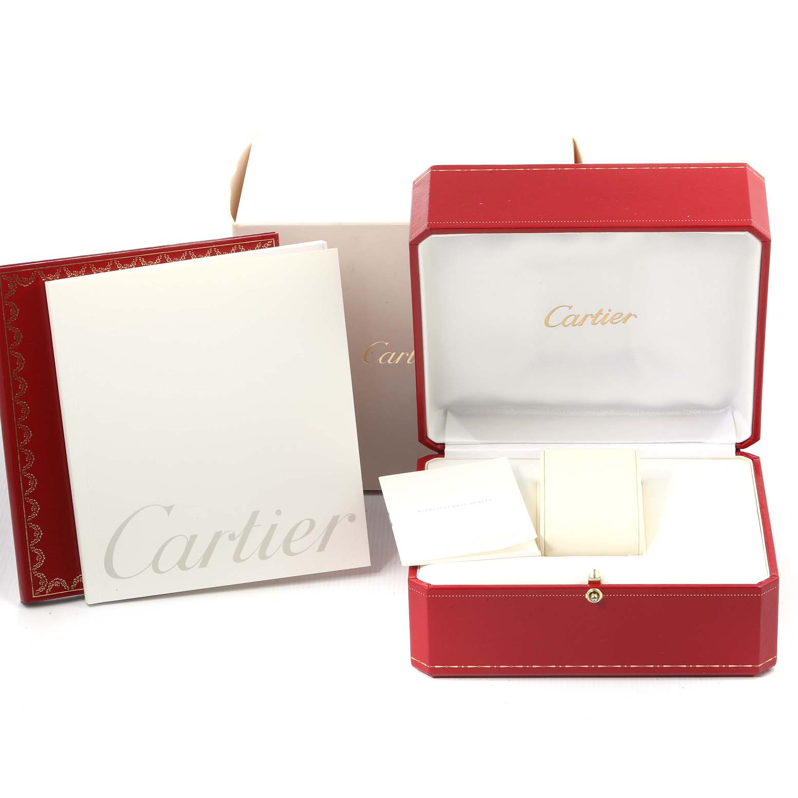 The image shows the packaging and accessories for a Cartier Roadster W62004V3 Men's Stainless Steel Black Dial W62004V3 Men's Stainless Steel Black Dial watch, including the red box, outer box, booklets, and cushion.