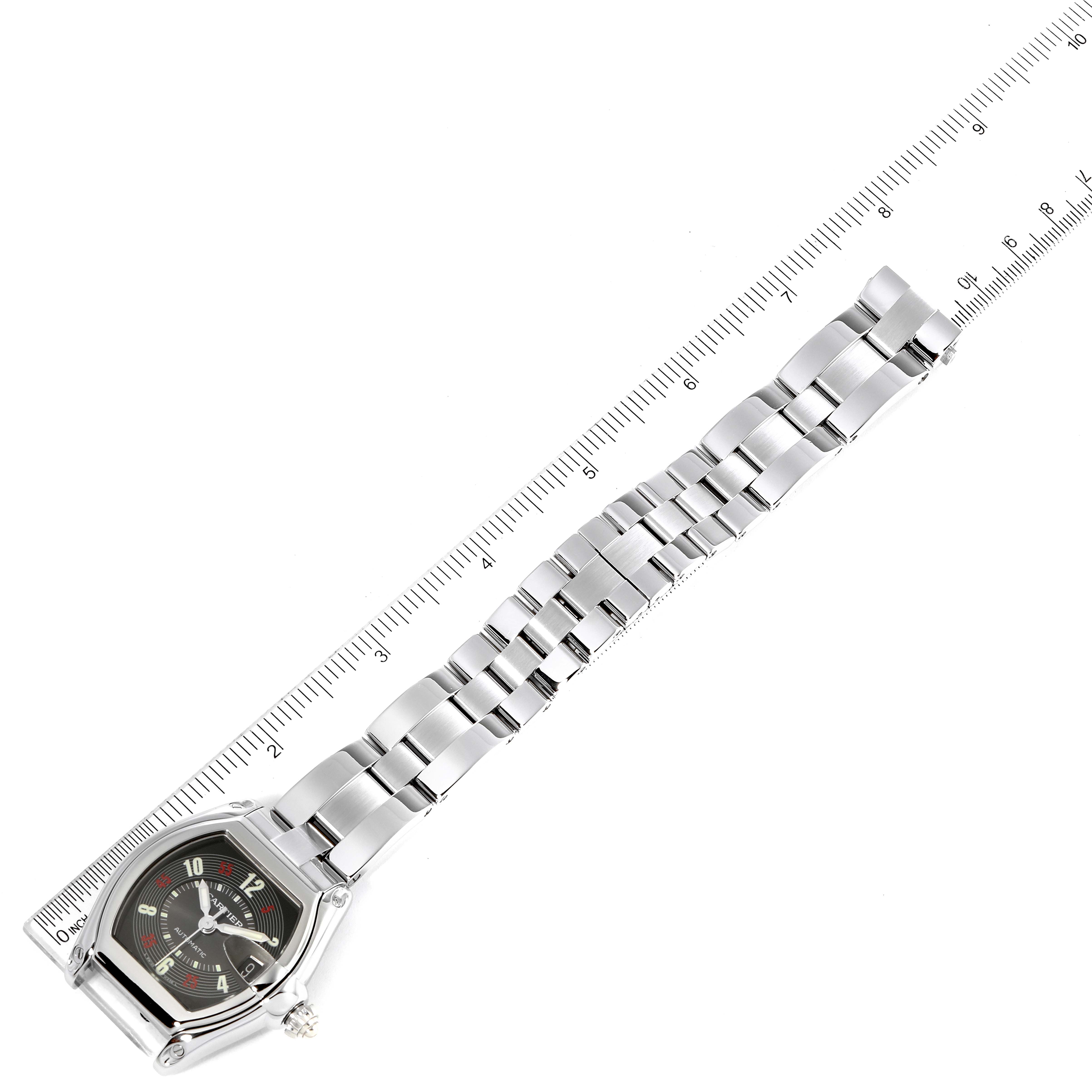 The Cartier Roadster W62002V3 Men
s Stainless Steel Black Dial W62002V3 Men
s Stainless Steel Black Dial watch is shown from a top-down angle, featuring the entire watch and bracelet aligned with a ruler.