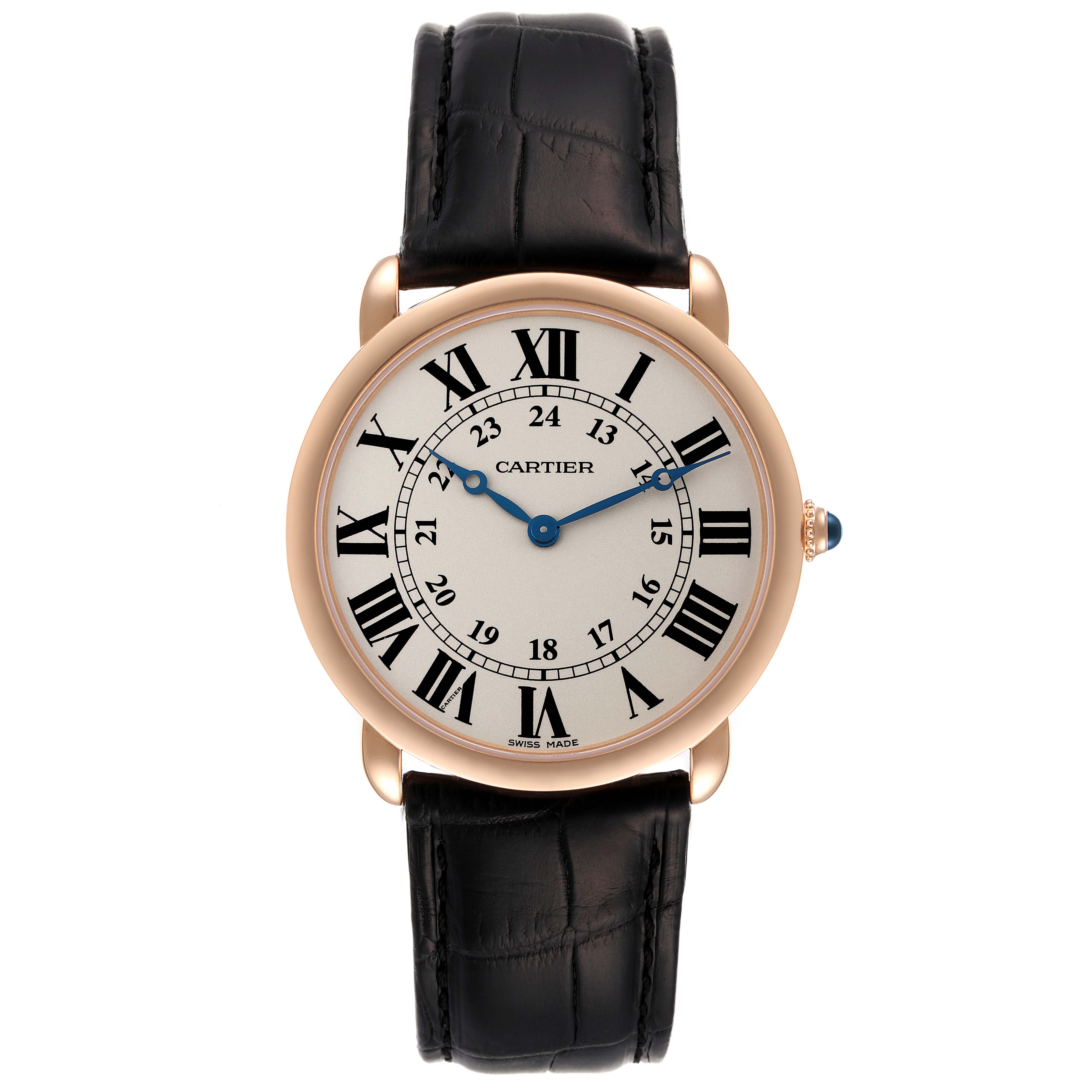 The Ronde model watch by Cartier is shown from a front angle, displaying its face, Roman numerals, blue hands, and black leather strap.