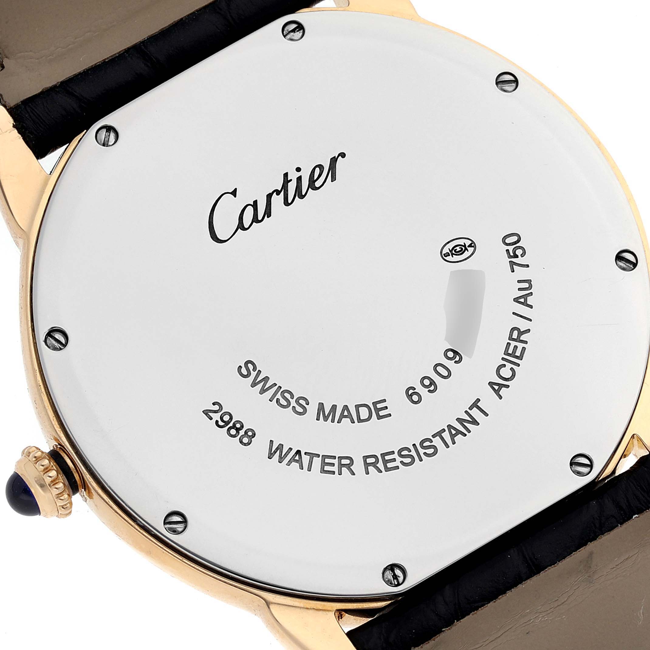 The image shows the back of the Cartier Ronde W6700455 Men's Yellow Gold Silver Dial W6700455 Men's Yellow Gold Silver Dial watch, highlighting the branding, serial number, and water resistance details.
