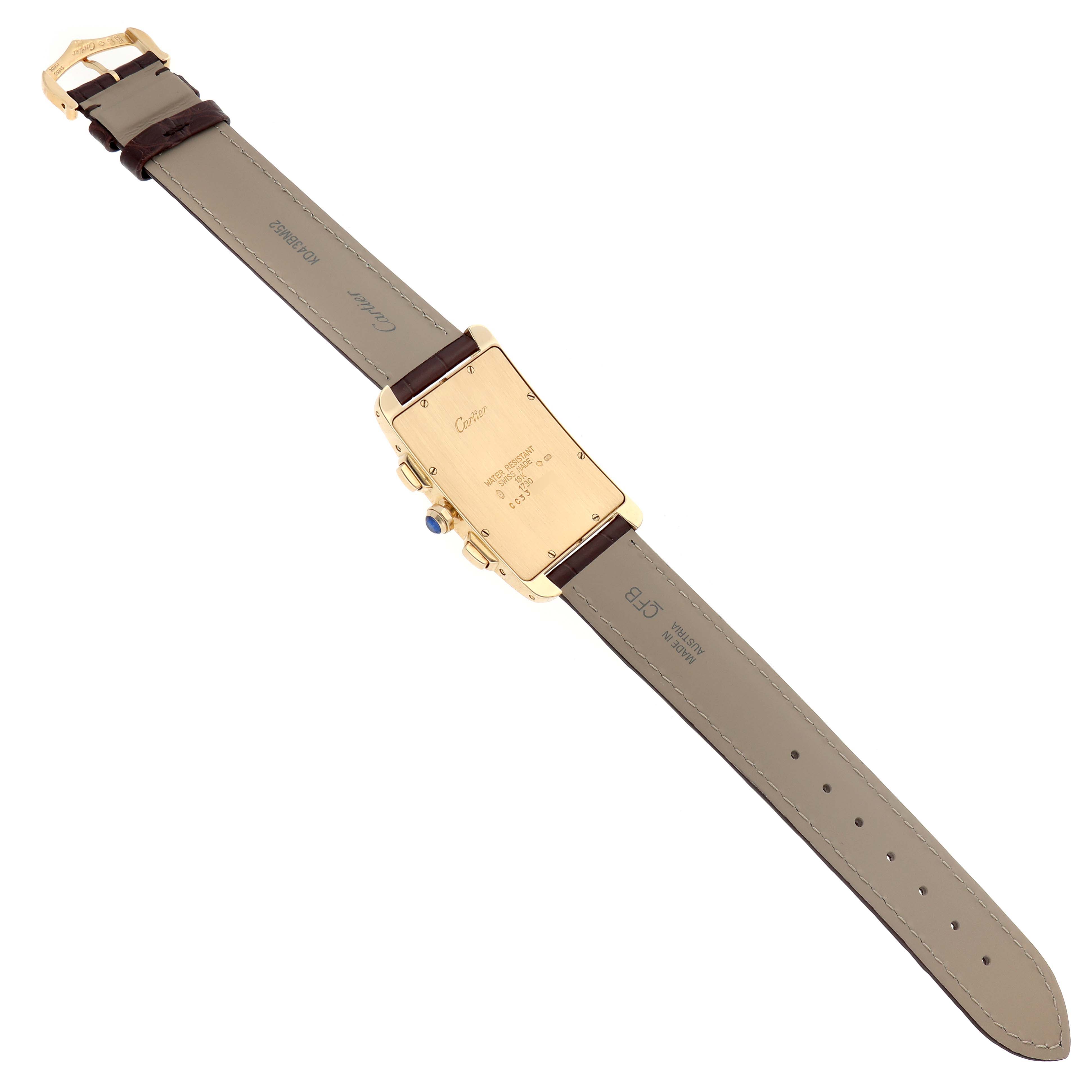 The image shows the back of the Cartier Tank Américaine watch, highlighting the case back, strap, and clasp.