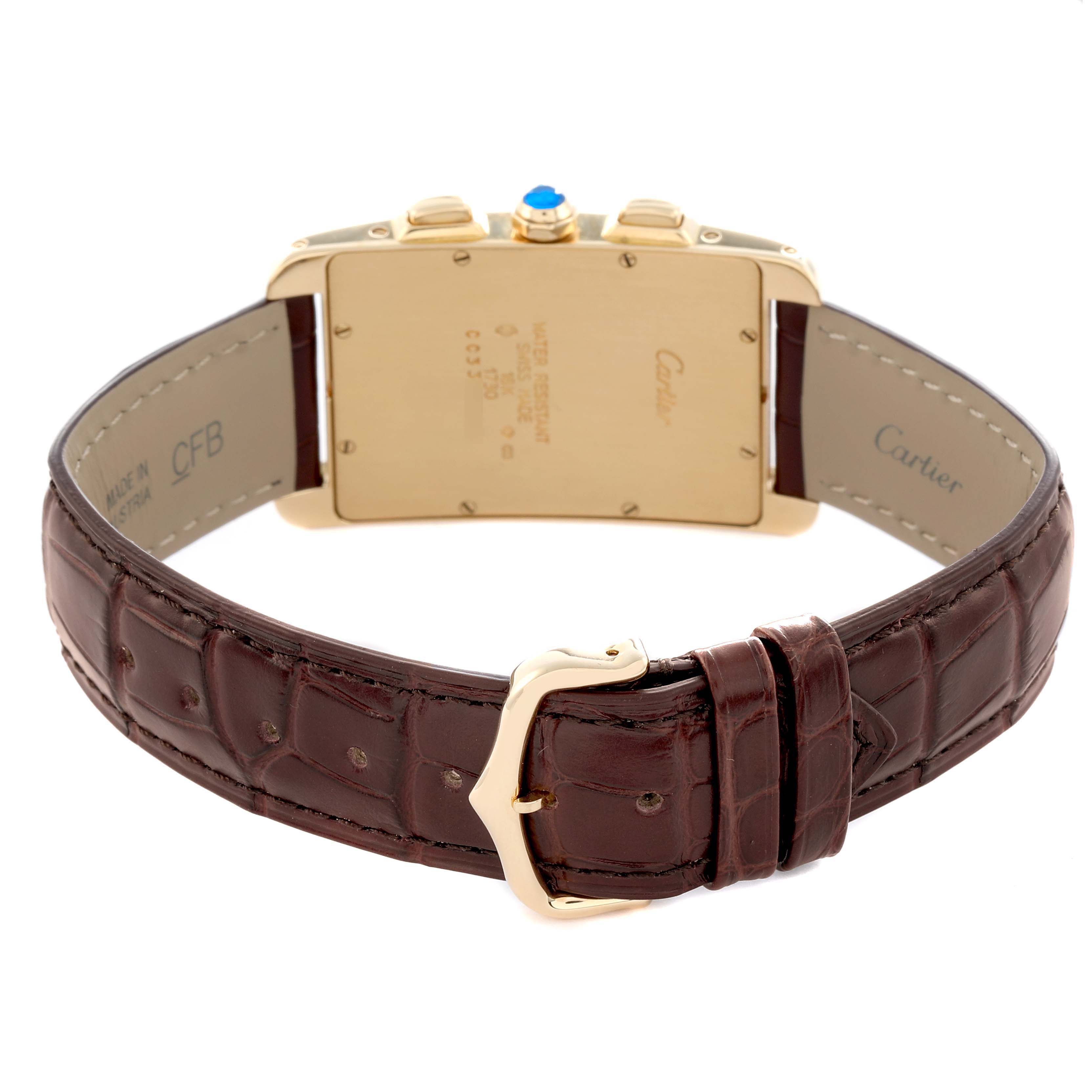 The Cartier Tank Americaine W2601156 Men
s Yellow Gold Silver Dial watch is shown from the back, displaying its case, strap, and buckle.