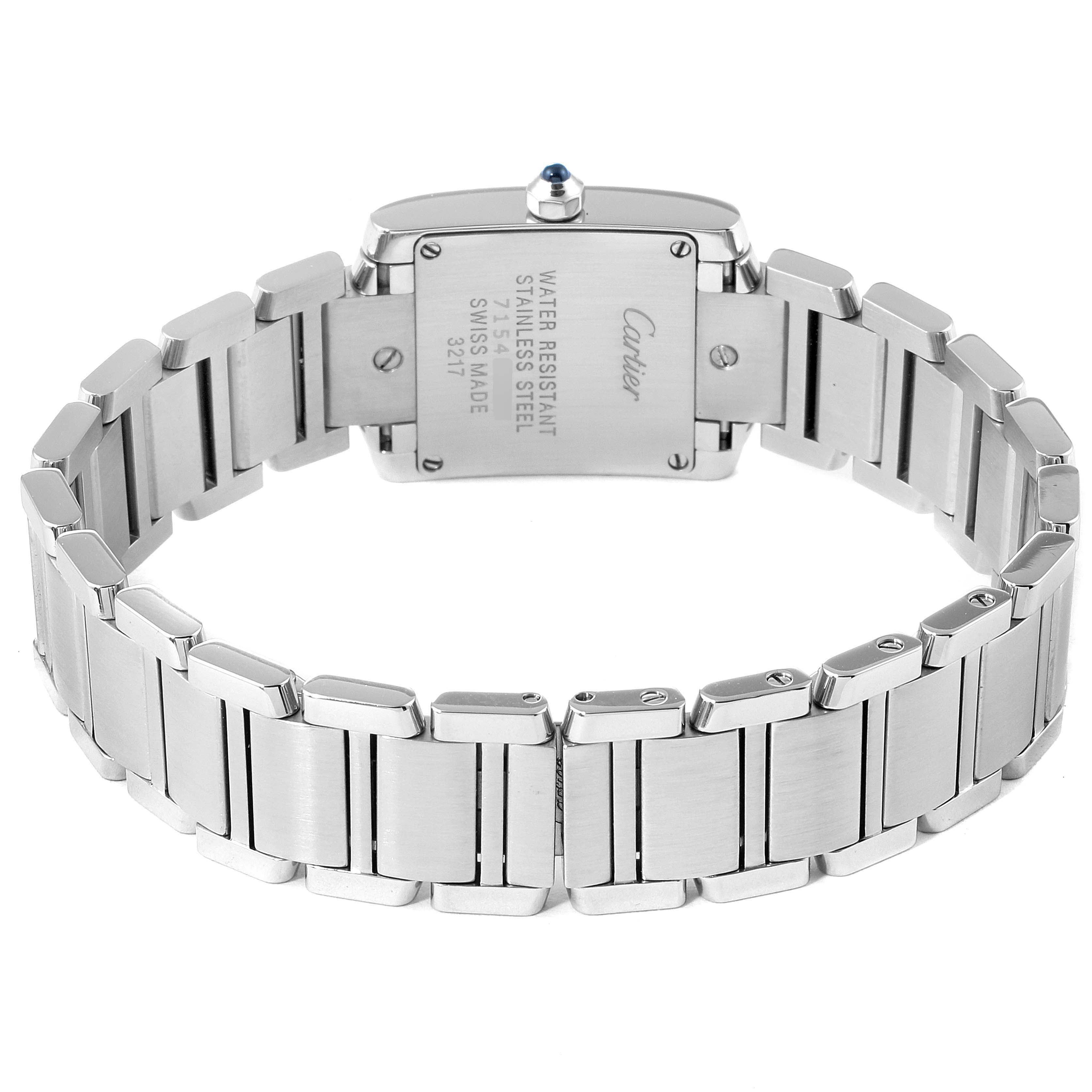 The image shows the back and bracelet of the Tank Francaise watch by Cartier, highlighting the stainless steel case and links.