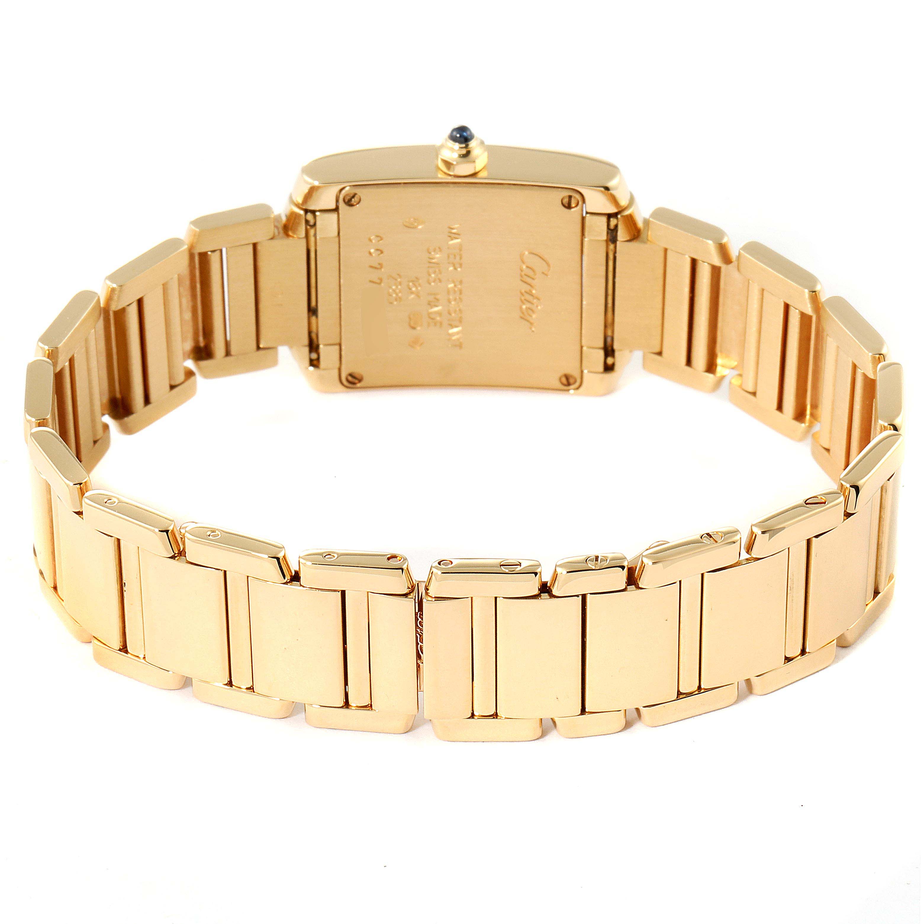 The image shows a Tank Française model by Cartier from the back, highlighting the case back and gold bracelet.