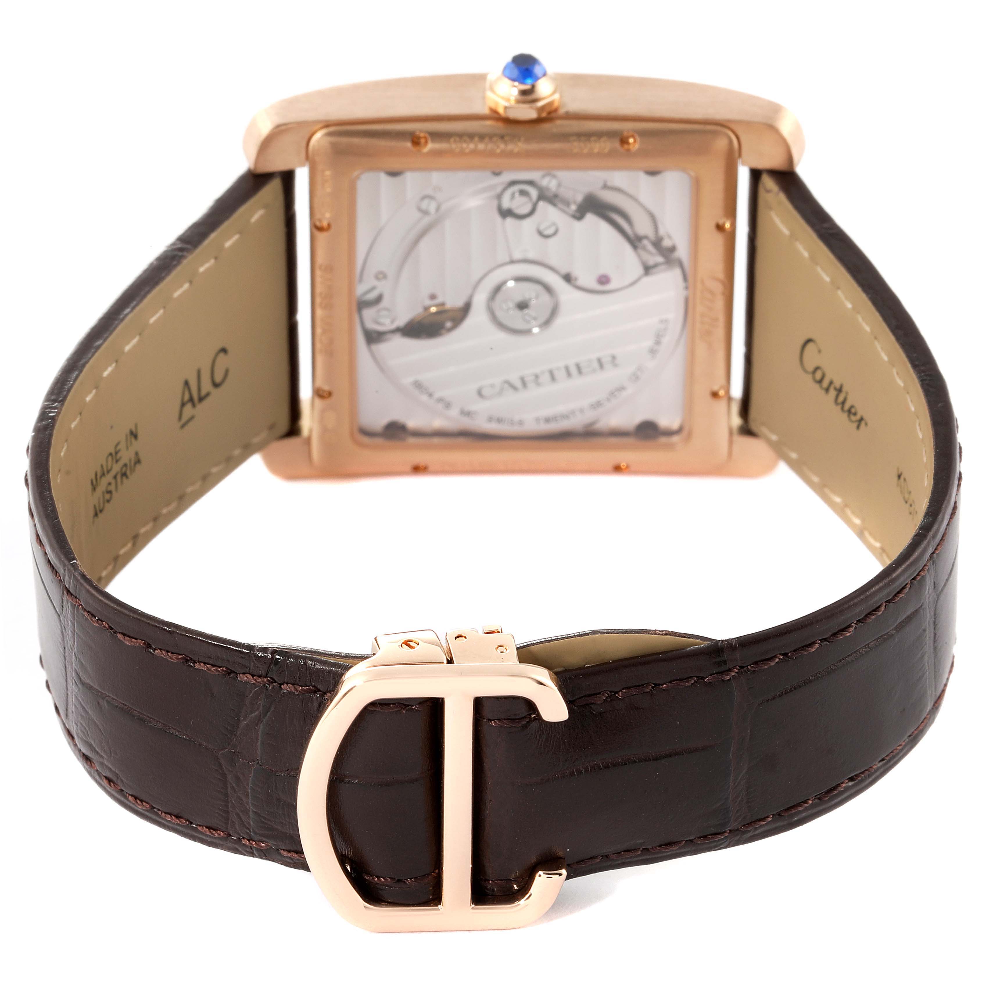 The image shows the back view of the Cartier Tank MC W5330002 Men
s Rose Gold Brown Dial W5330002 Men
s Rose Gold Brown Dial watch, highlighting the movement, crown, and leather strap with the Cartier clasp.