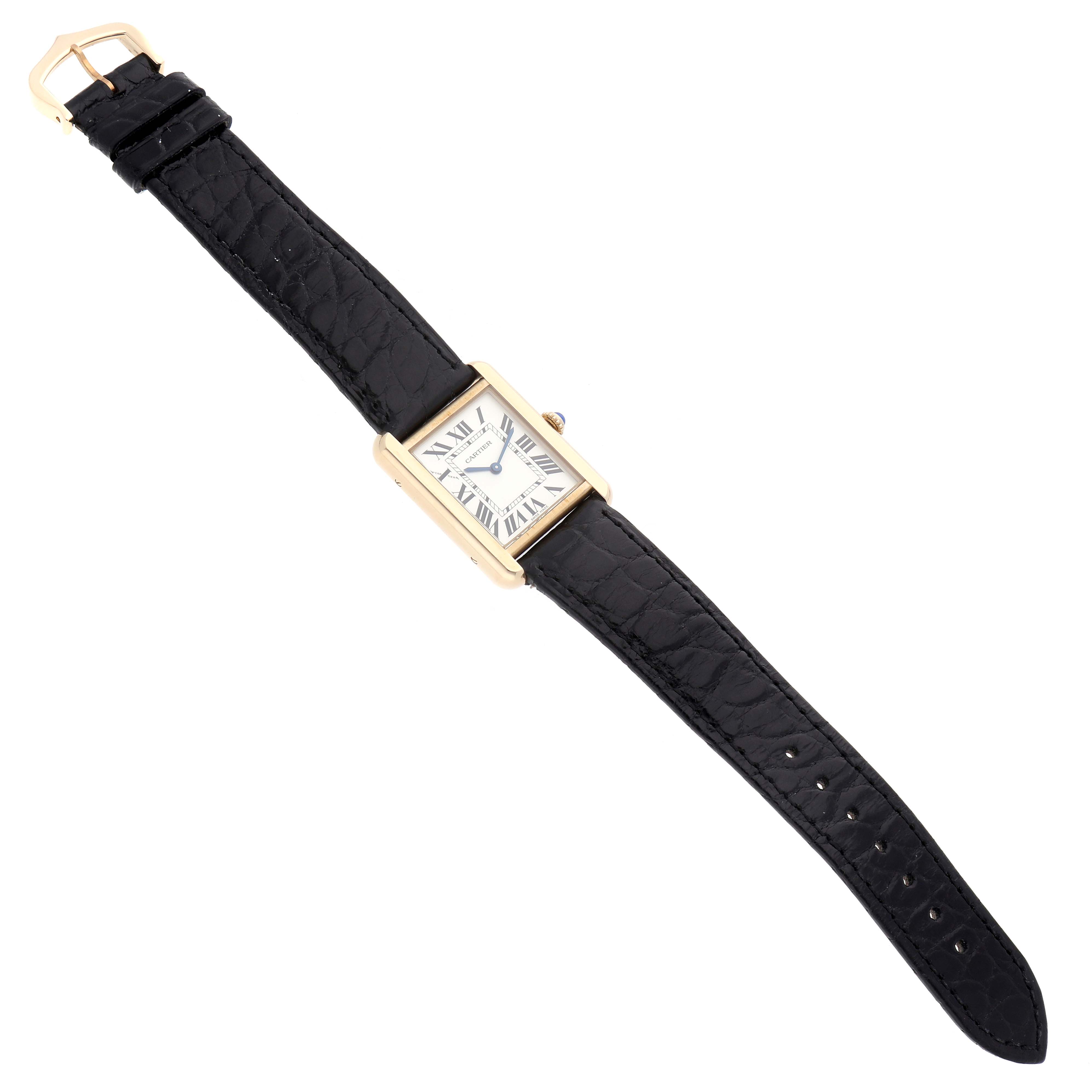 The Cartier Tank Solo W5200002 Women's Yellow Gold White Dial watch is shown from a top-down angle, displaying the entire face, case, and strap.